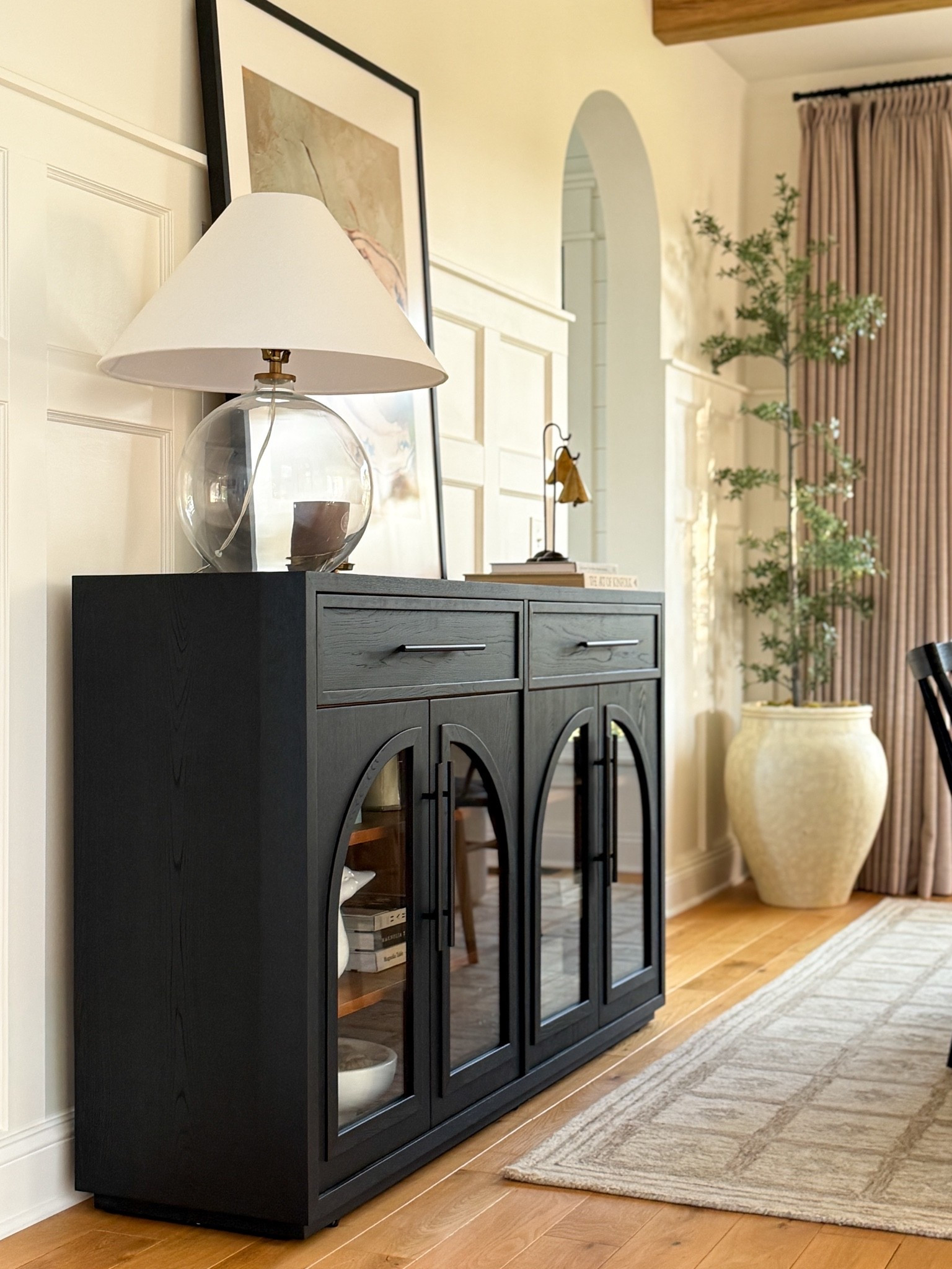 Dining room, credenza, buffet, arched details, beautiful storage, black cabinet, pottery barn, hernest, neutral, transitional modern, interior design, home decor

#LTKHome