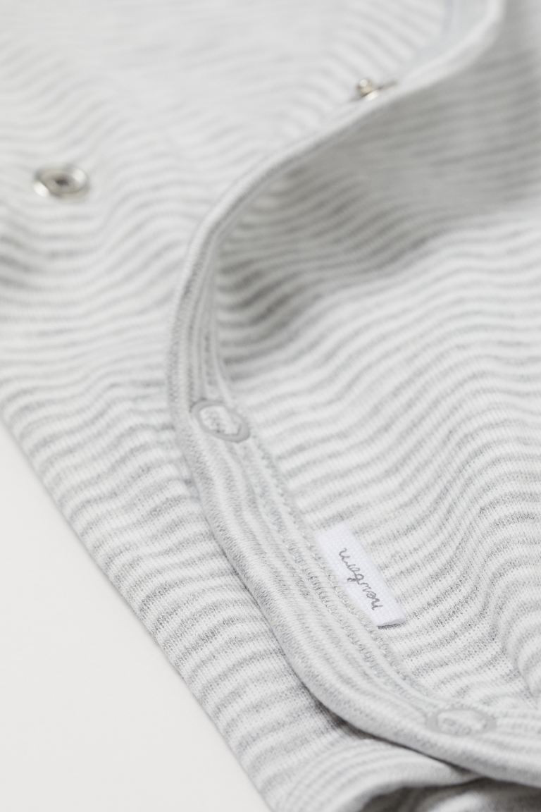 Conscious 
	Long-sleeved bodysuits in soft, organic cotton jersey with a wrapover front. Snap fas... | H&M (US + CA)
