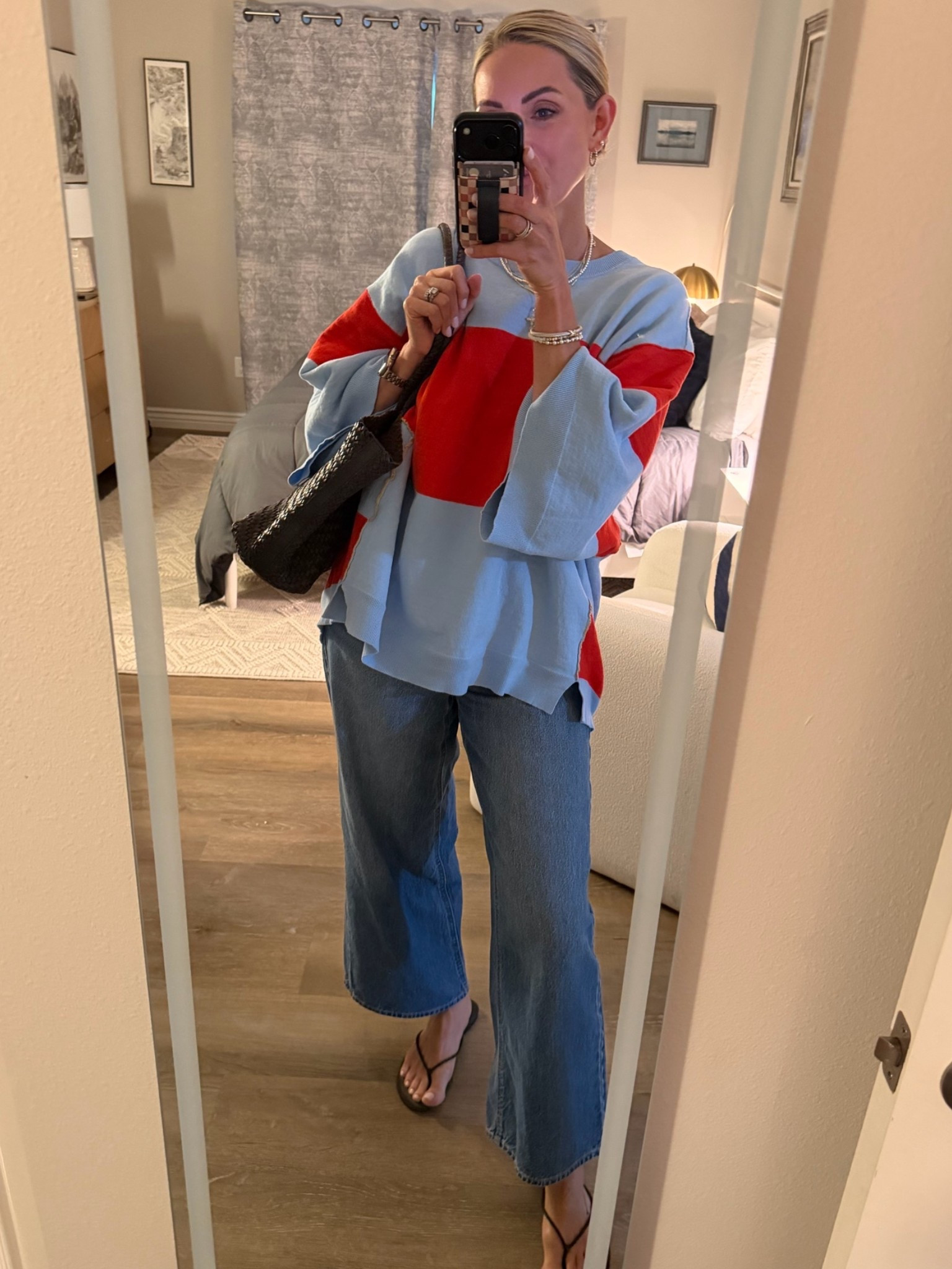 Runs big. So big and comfy like your favorite blanket. I love the sleeves and high-low style.