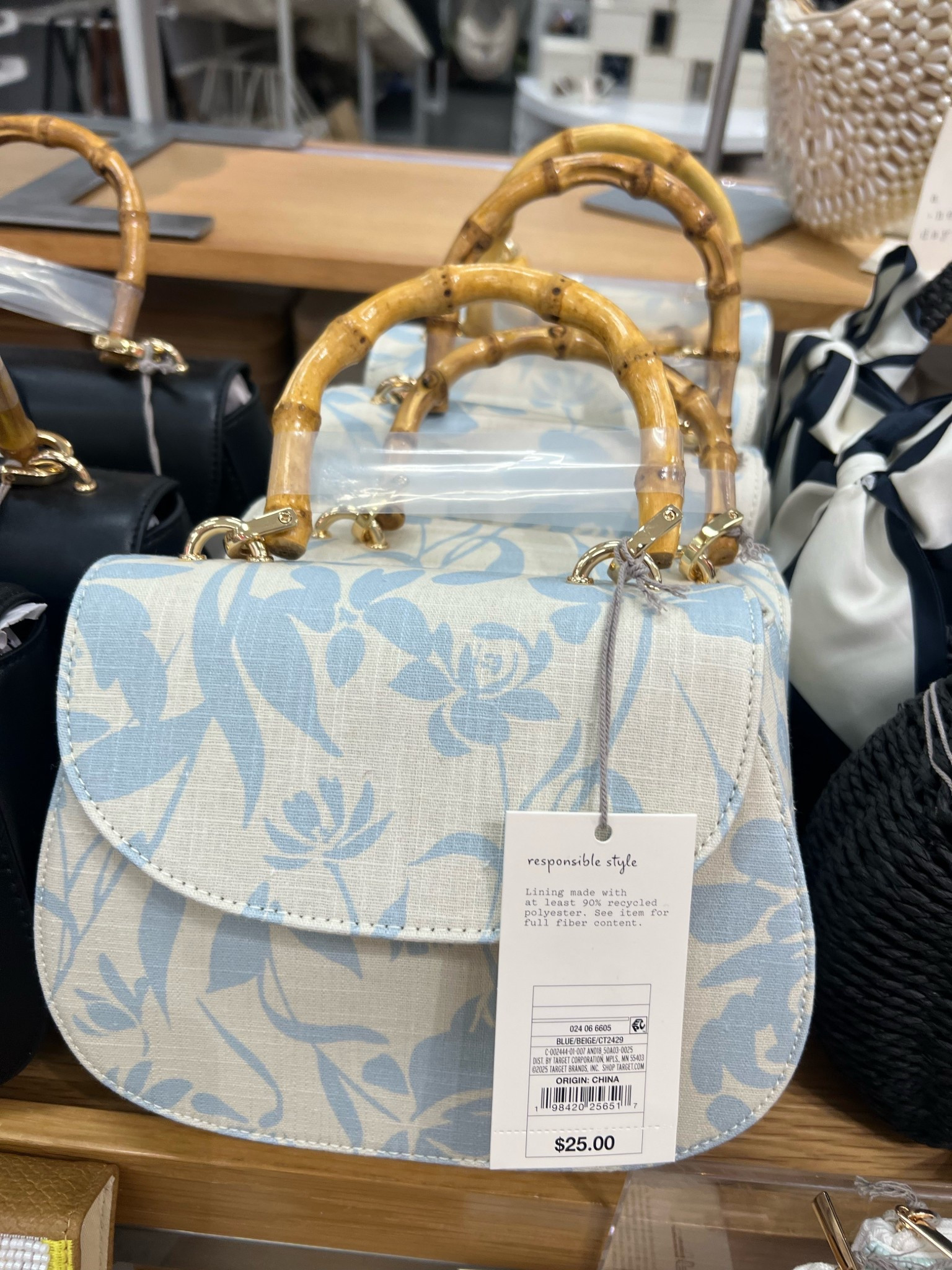 Flirty florals and a hint of bamboo make this handbag a must-have for the season. 💙 #SpringEssential #TargetStyle #OnTrend #SpringFashion

#LTKFindsUnder50 #LTKItBag #LTKStyleTip