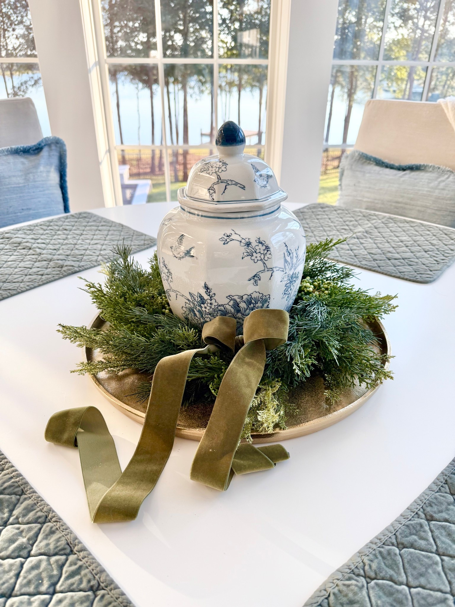 Mini wreath and blue and white lidded ginger jar on brass colored tray 
Christmas decor
Holiday decorations 
Blue silk pillows 

#LTKHoliday #LTKHome