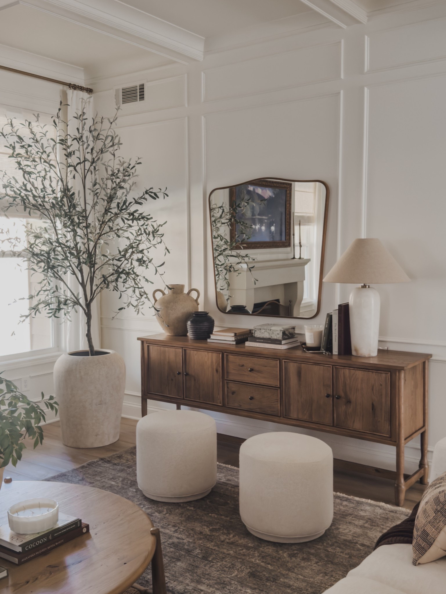 One of my favorite functional yet aesthetic furniture pieces is my stunning sideboard. With ample storage and plenty of space to style each season - it’s the perfect wood tone that blends seamlessly yet functional for every day use.

Home finds, neutral home inspo, furniture favorites, neutral wood tones, sideboard details, ottoman details, oversized mirror, faux olive tree, table lamp, collected style, neutral area rug, vintage style area rug, round coffee table, linen sofa, planter details, faux florals, decor book, wainscoting details, Pottery Barn style, Four Hands, Loloi, Amber Lewis, linen detail, neutral curtains, shop the look!

#LTKHome #LTKSeasonal