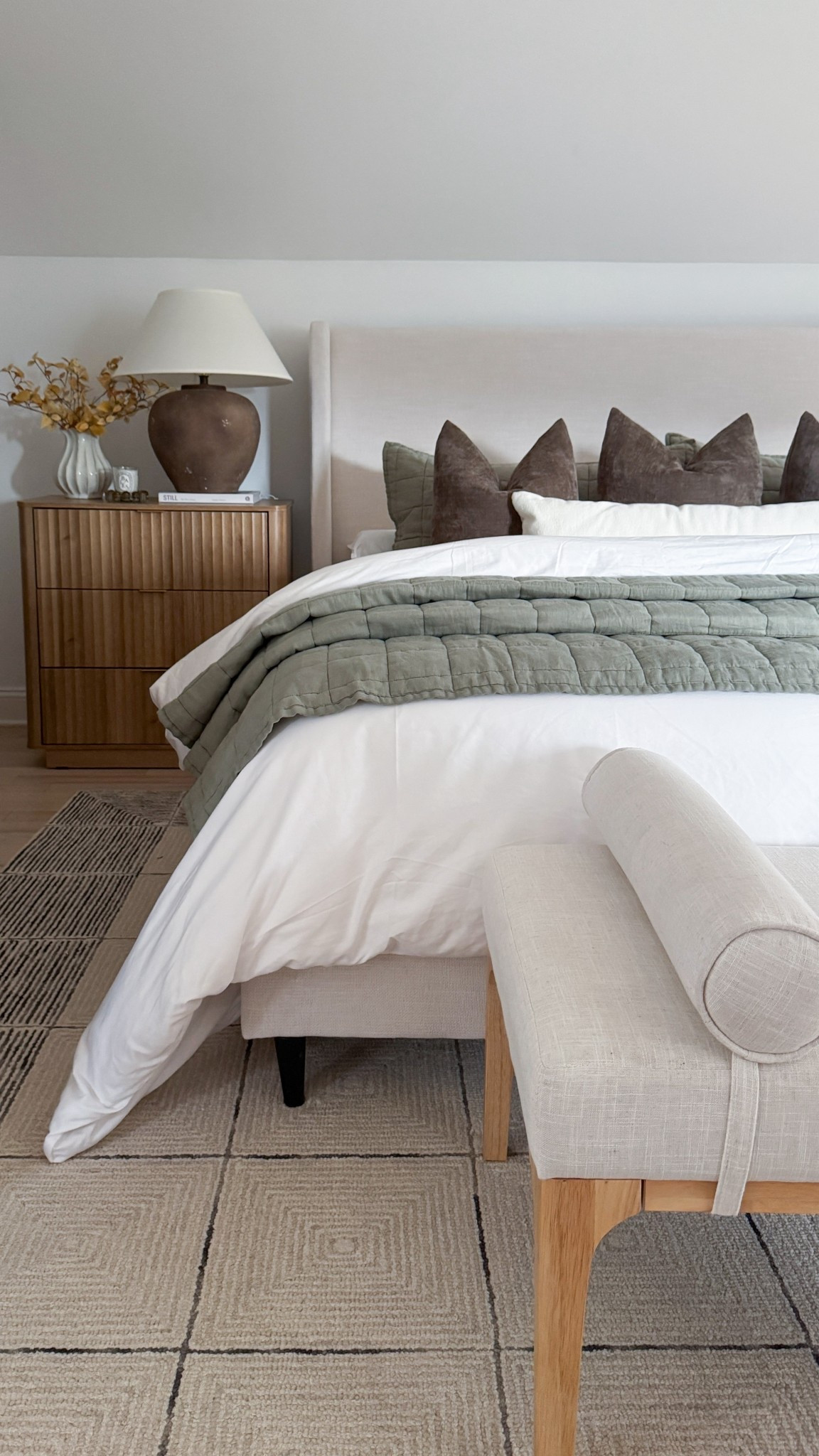 Neutral layers + cozy textures = my happy place 🤍 

This bedroom setup is filled with those designer-look-for-less pieces I always gravitate toward—clean, simple, and elevated without trying too hard. The green quilt adds such a soft pop of color against all the neutrals, and it might just be my favorite detail right now.



#neutralbedroom #cozyhomevibes #bedroomstyle #modernorganic #homedecor

#LTKHome #LTKSeasonal #LTKTall