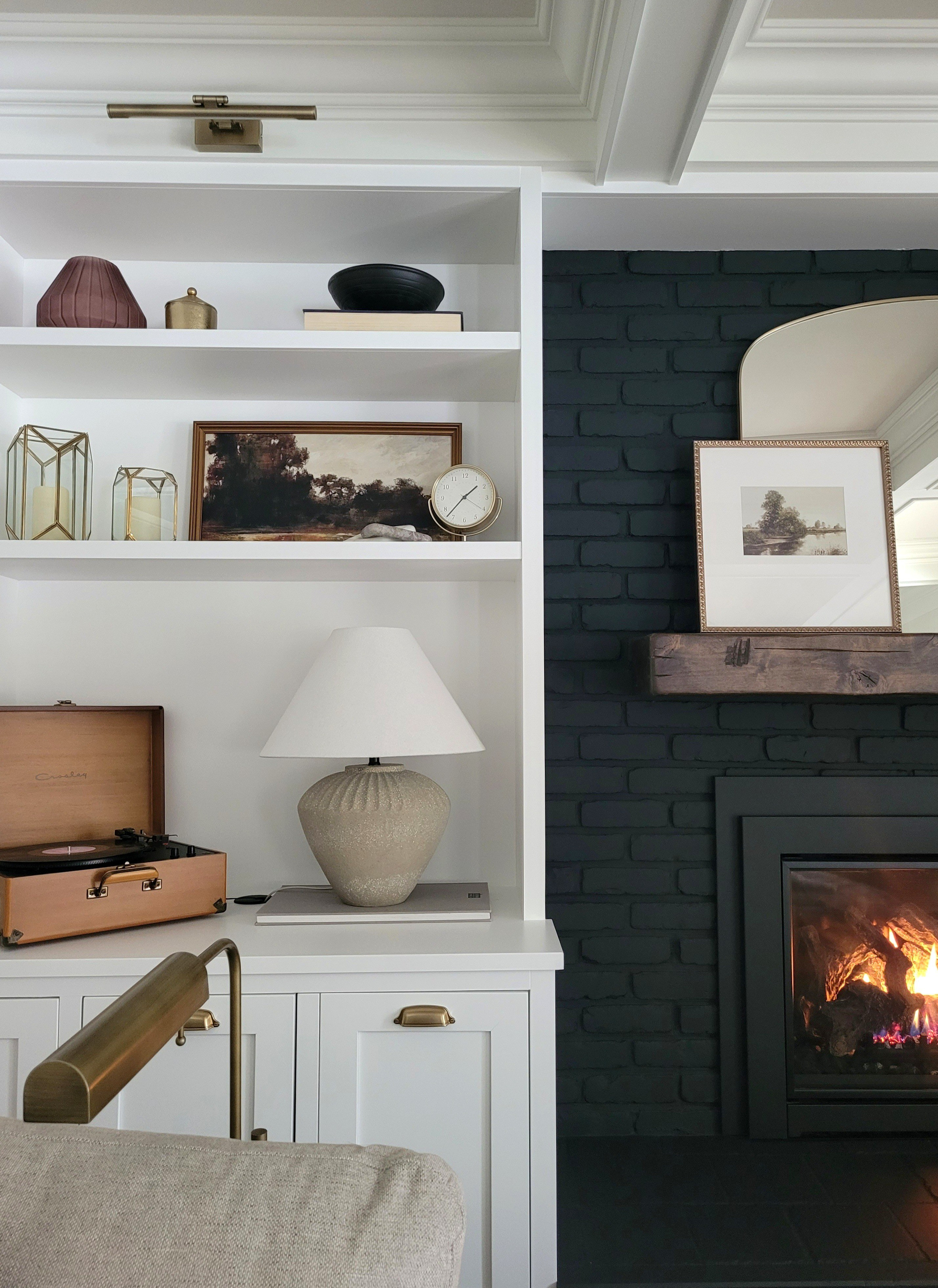 Winter shelf styling refresh - neutral home decor, living room, family room, vintage inspired art, bringing cozy into the house after the holidays, lamp, floor lamp, sectional sofa, look for less, black fireplace, built ins, amazon cabinet hardware, cabinet pull

#LTKHome