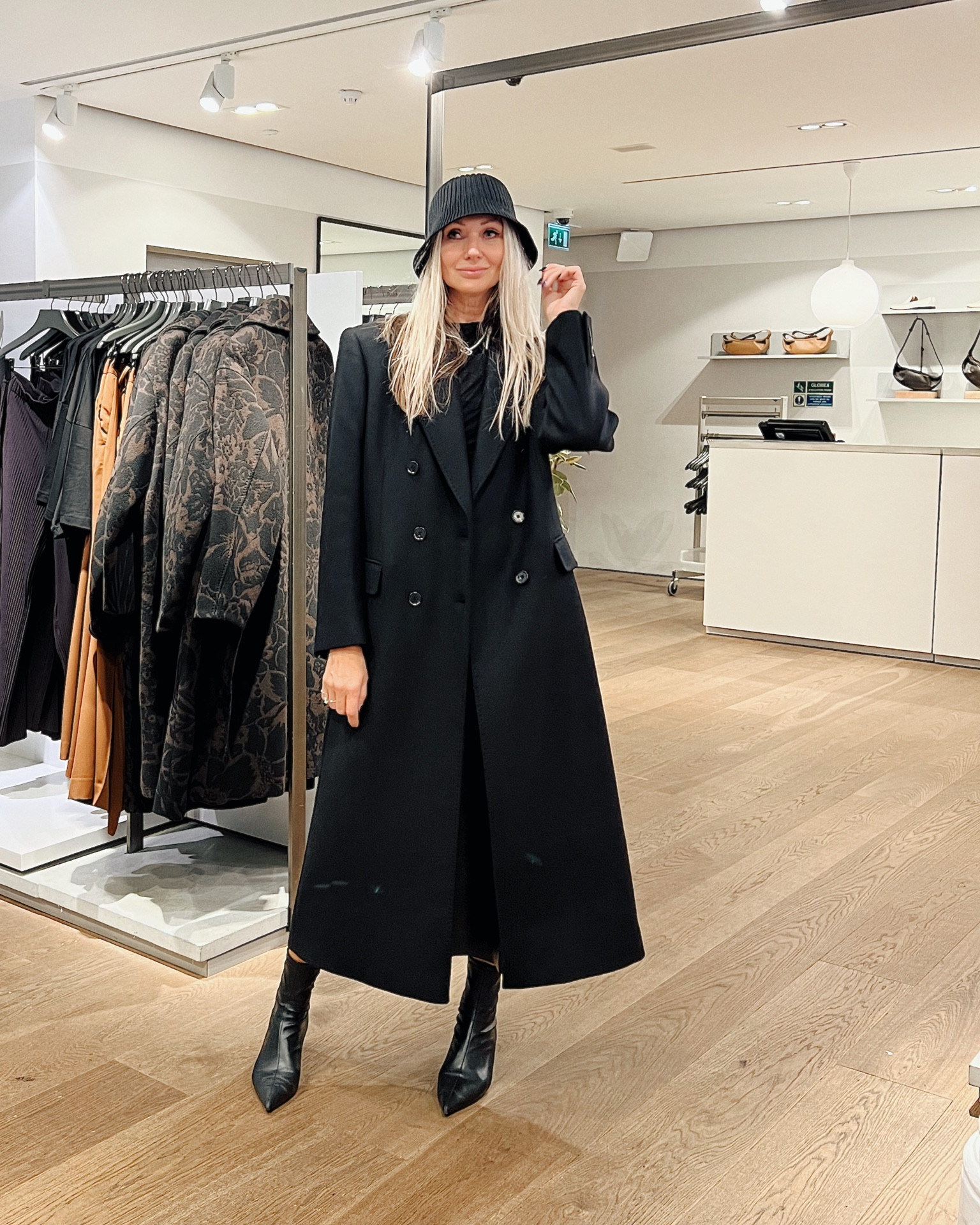 Oversized black coat and bucket hat. 
I’m wearing one size bigger coat for me as I have long arms 

#coscoat #blackcoat #oversizedcoat #buckethat #autimnfashion #cos 

#LTKstyletip #LTKSeasonal #LTKeurope