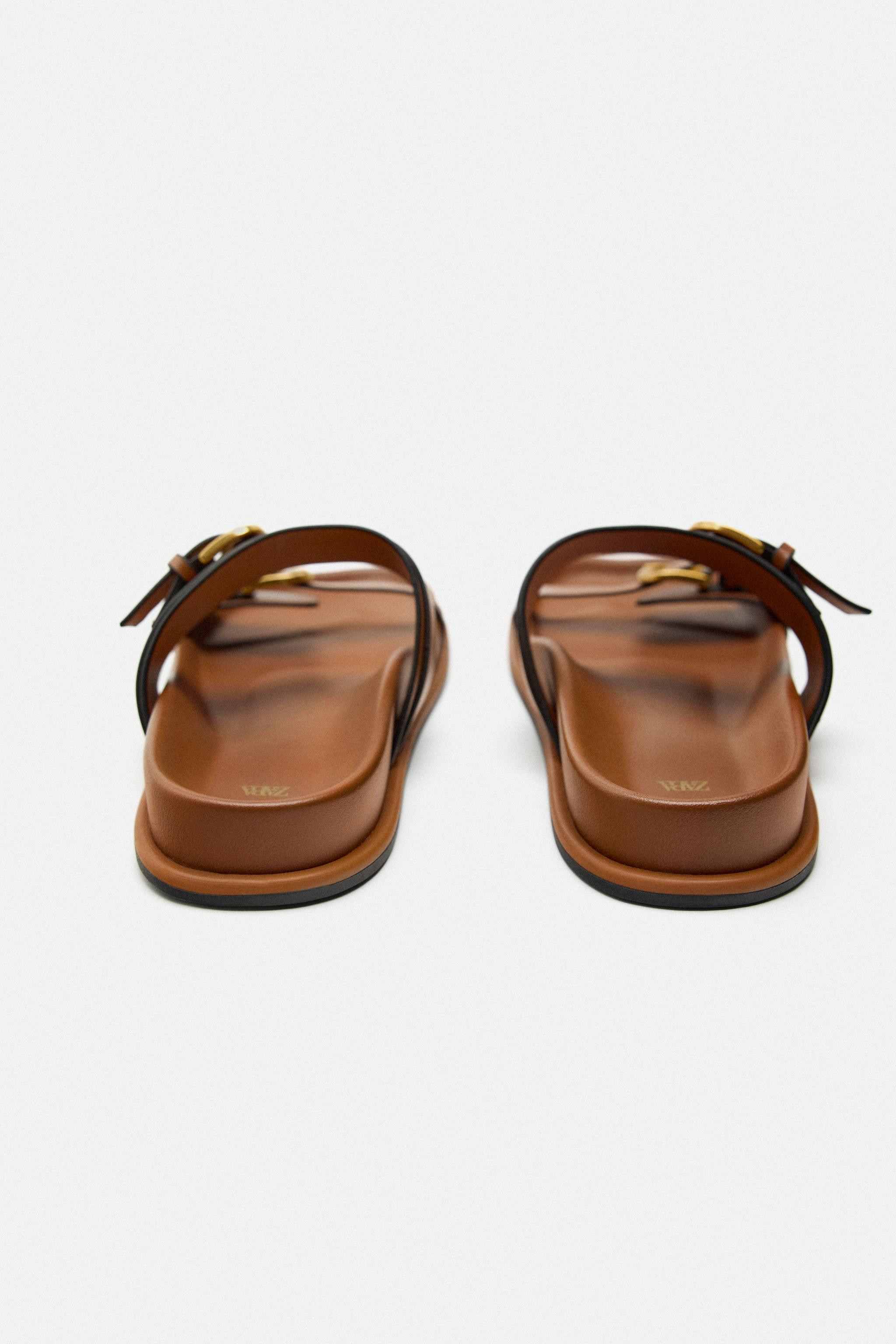 Flat sandals with buckled straps. Round toe. Sole height: 1 inch (2.5 cm) | Zara US
