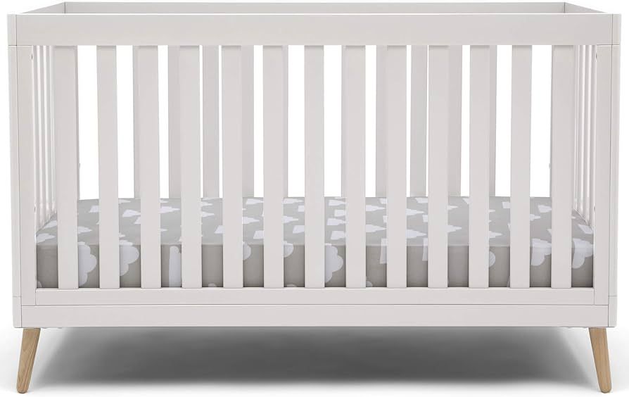 Delta Children Essex 4-in-1 Convertible Baby Crib, Bianca White with Natural Legs | Amazon (US)