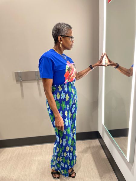 Short-sleeve graphic tee
Dark blue hue with colorful graphic of 5 Black friends

Long-sleeve button-down shirt floral print
button-down closure
Below-waist length

Black History Month Target x Sammy B Women's Wide Leg Pleated Trousers - Blue Floral

#LTKstyletip #LTKFind #LTKunder50