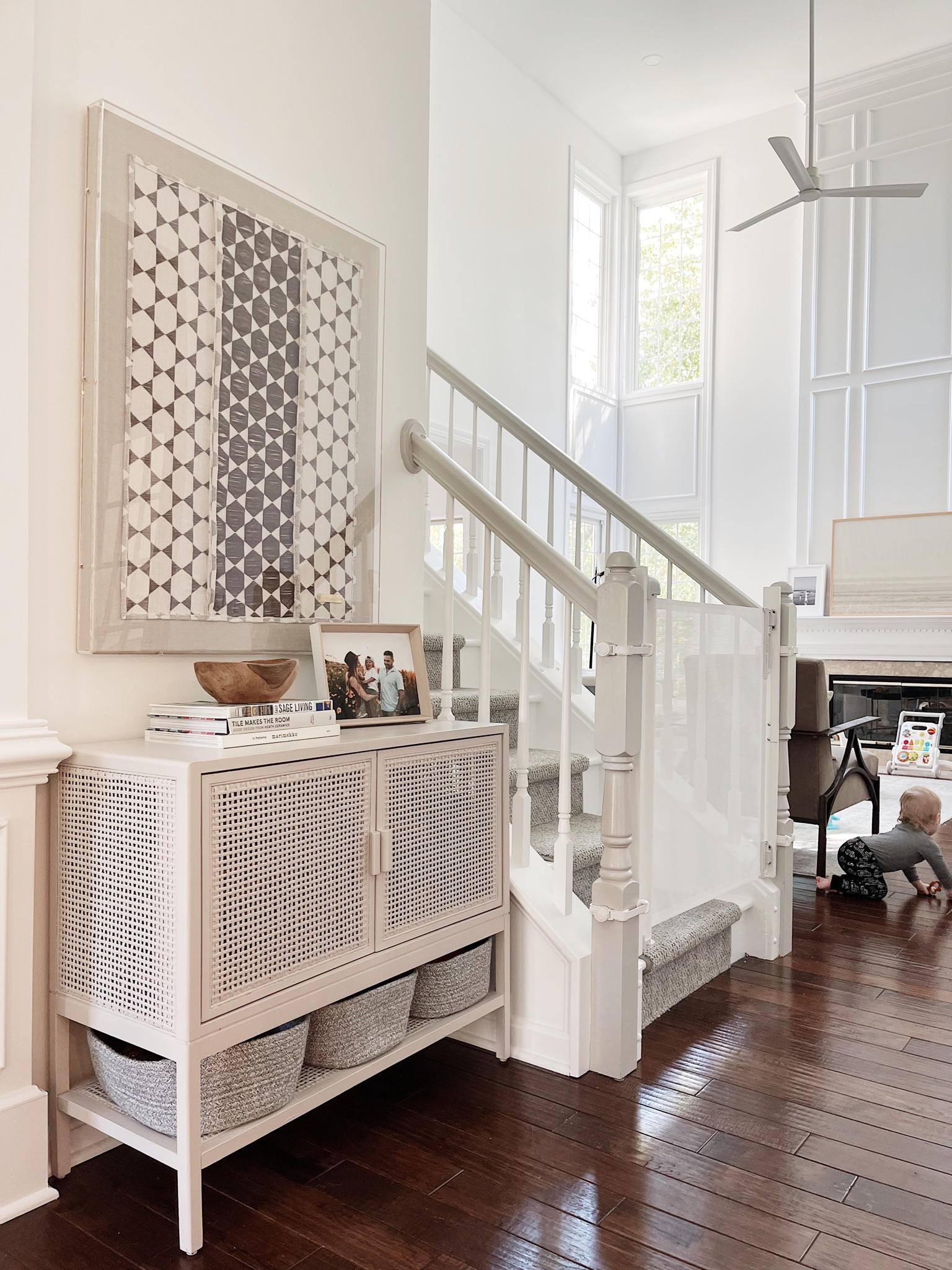 Installed our baby gate at the bottom of the steps. We used these no drill adapters for the bottom banisters and then this fabric gate that can easily roll closed and out of use. Super happy with how it’s working. Please note: I’m not a baby proofing expert. Just sharing what works for us. Will share top of steps soon but that will be bolted into the walls/banister for safety. ✨ 

#LTKkids #LTKhome #LTKfamily