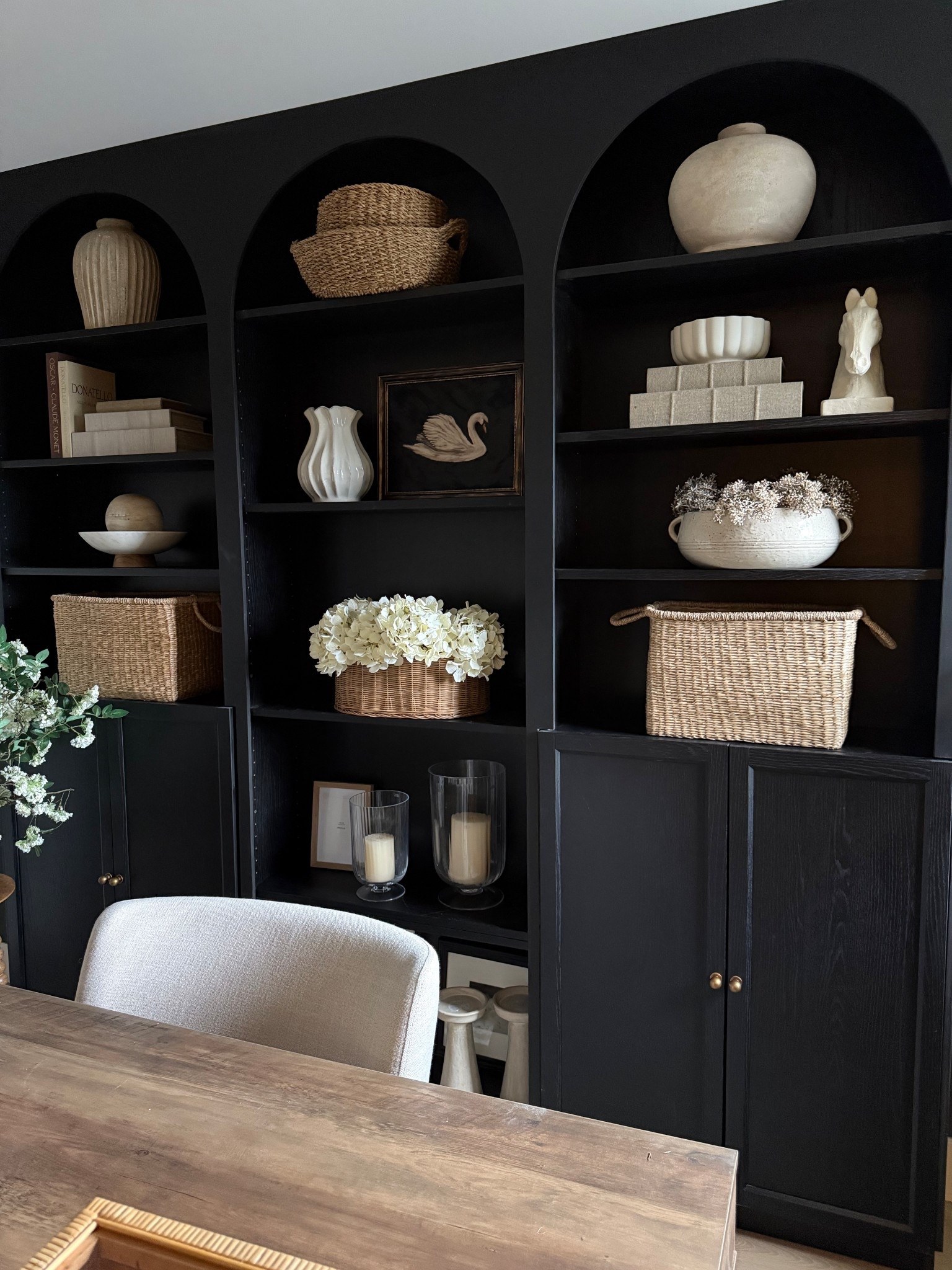 Home office! 
These are the Billy bookcases from
Ikea. We have three here. 
(We diy’ed the arches! )