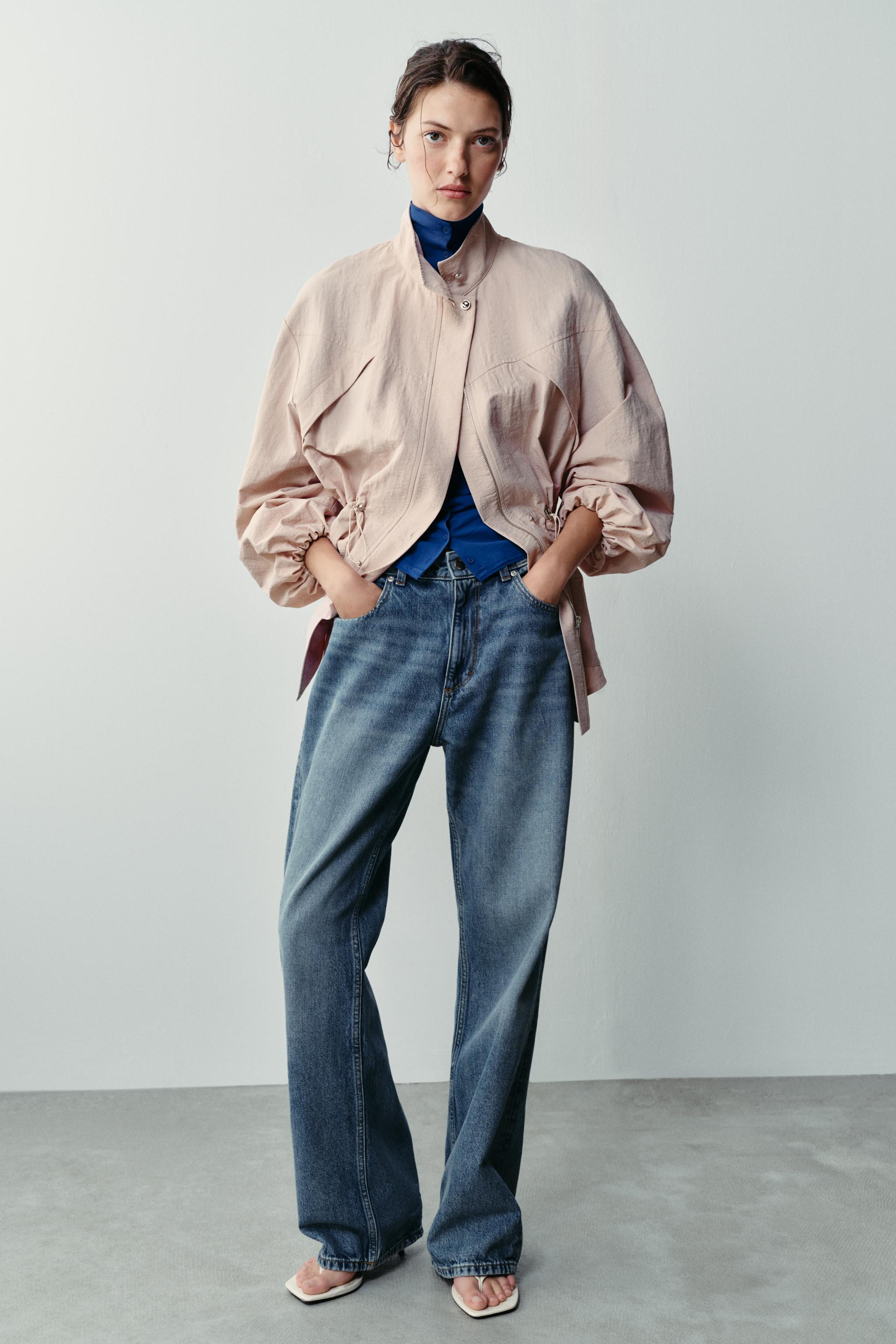 Stand-up collar jacket with long sleeves featuring elastic cuffs. Adjustable waist with elastic d... | Zara US