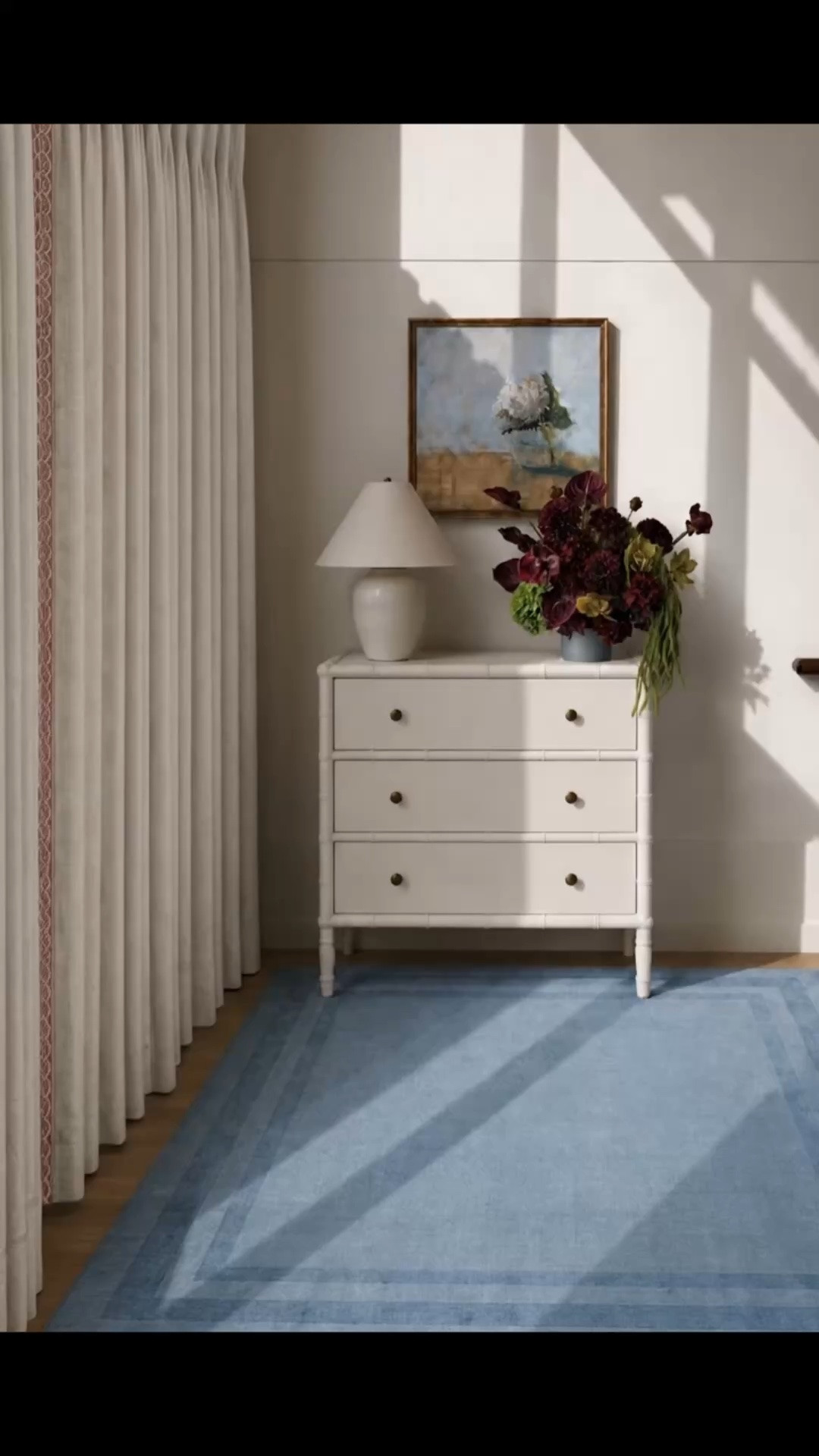 Monday morning, refreshed for the season with soft sunshine, richer color, and a few simple updates. ✨

I originally styled this stair landing with sheer drapes and blue hydrangeas, but changing just a few details gives the entire space a warmer, more transitional feel. The white linen French-pleated drapes with a soft pink border add more structure and a tailored finish, while the deep burgundy floral arrangement brings in that beautiful early-fall richness.

The Serena & Lily three-drawer chest is still the anchor of the vignette. I love how versatile this piece is—it works beautifully on a stair landing like this, but could just as easily be used in an entryway, hallway, bedroom, or living space. The clean white finish, brass hardware, bamboo-inspired detailing, and generous storage make it both polished and practical.

The artwork adds another layer of softness and color above the chest, while the blue rug keeps the whole area feeling relaxed, collected, and balanced.

Serena & Lily’s Labor Day Sale is happening now, with up to 40% off—such a good time to refresh a space with furniture, rugs, lighting, textiles, and decorative pieces for the season ahead.

#MondayMorning #SerenaAndLily #LaborDaySale #SerenaAndLilySale #ThreeDrawerChest #StorageChest #StairLanding #LandingDecor #EntrywayDecor #HallwayDecor #Artwork #WallArt #LinenDrapes #FrenchPleatDrapes #WindowTreatments #FloralArrangement #BurgundyFlowers #AreaRug #BlueRug #CoastalChic #ModernClassic #TransitionalDecor #SeasonalRefresh #HomeRefresh #LTKHome #LTKdayinmylife #LTKSaleAlert

#LTKdayinmylife #LTKHome #LTKSaleAlert