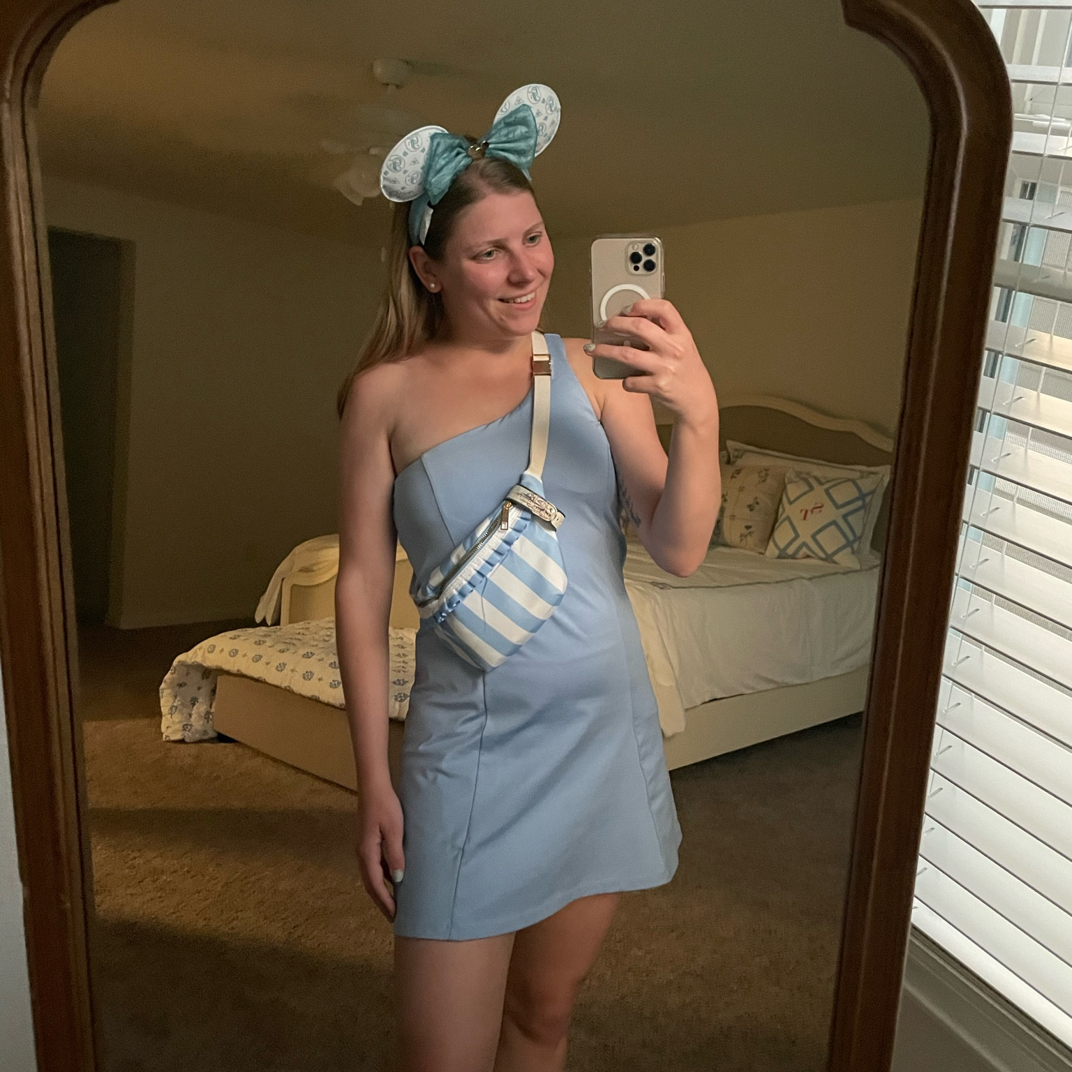 One shoulder light blue tennis dress & blue striped ruffle fanny pack under $50. Stoney clover dupe  