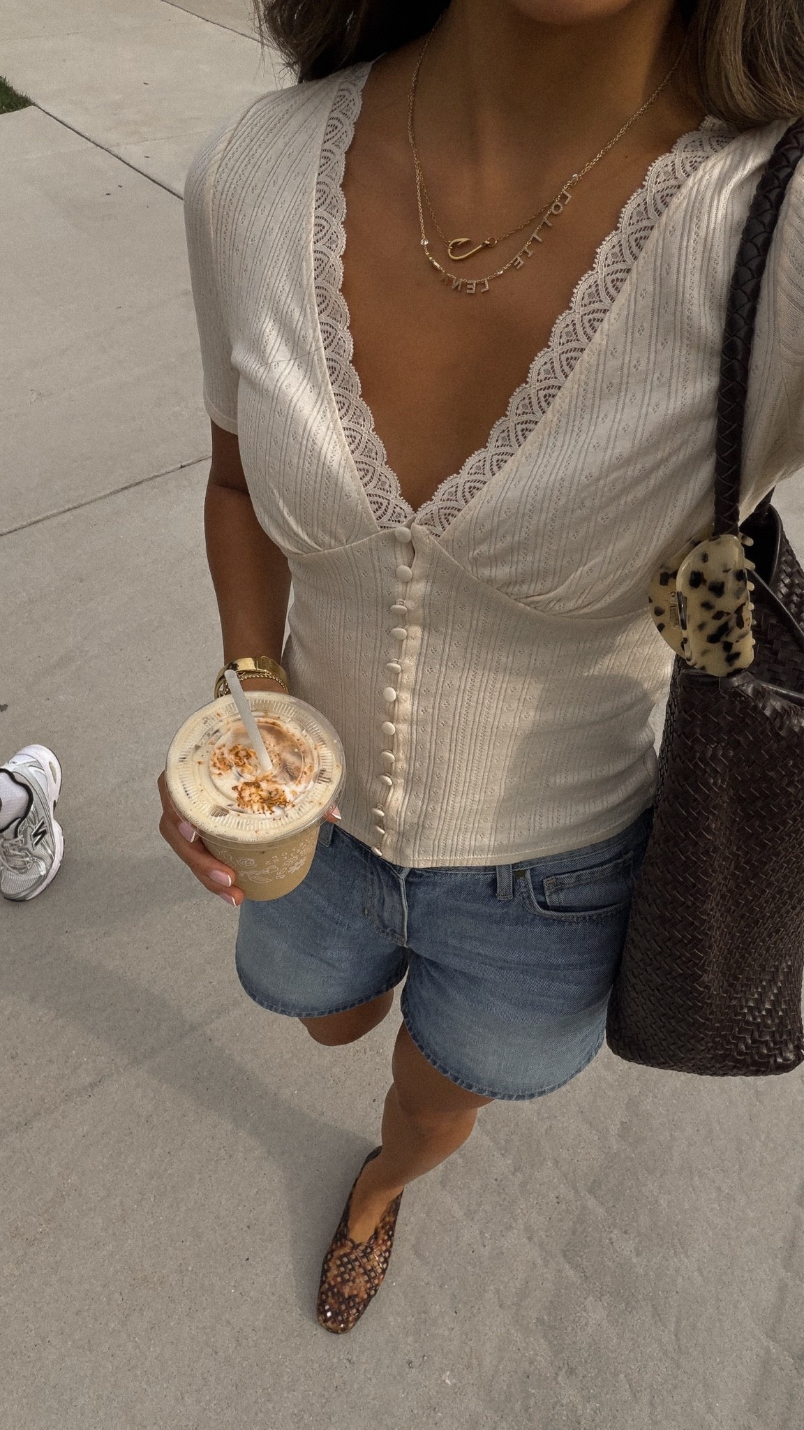 Dainty top and a good pair of denim! Wearing my favorite jelly flats and woven bag with it!