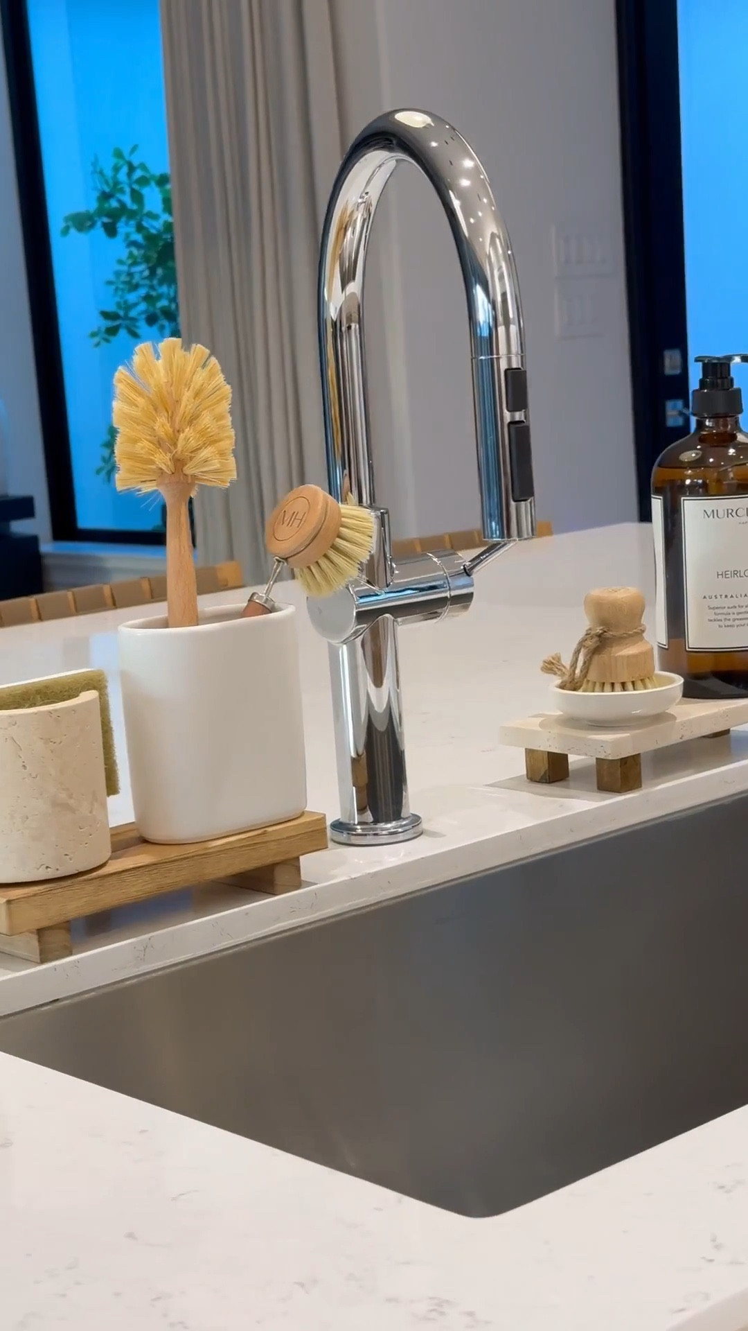 Kitchen Sink Essentials: 

Wooden & travertine risers 
Dish sponge holder 
Brush holders
Glass, pot, and dish brushes
Dish soap 
#LTKStyleTip 

#LTKSaleAlert #LTKHome