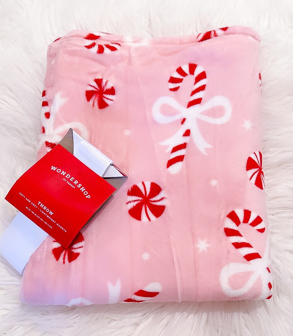 The Cutest Softest $10 Pink Christmas Blanket with Peppermint Candy & Candy Canes topped with Sweet Bows! 

Whether you’re a Pink Christmas girl, Pink and Red Christmas or Traditional Christmas with a little Pink - it’s perfect! 

Christmas Decor. Christmas Decorations. Home Decor. Traditional Christmas. Deck the Halls