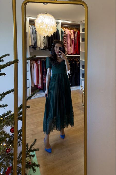 Elevate your Christmas brunch with timeless elegance in a Self Portrait Green Chiffon Lace Detail Midi Dress. Embrace the festive spirit with a touch of whimsy, accentuating the look with a charming pink hair bow positioned gracefully by the face. Grounding the ensemble are Gianvito Rossi Blue Satin Pumps, adding a subtle yet captivating hue. This Christmas outfit effortlessly transitions from cute to daytime formal, making it an ideal choice for Christmas brunch. Explore the perfect blend of sophistication and holiday charm, ensuring your attire stands out. #LTKGIFT #christmasoutfit #christmasdress #greendress #hairbow

LTKFestiveSaleUK LTKFestiveSaleDE #LTKHoliday