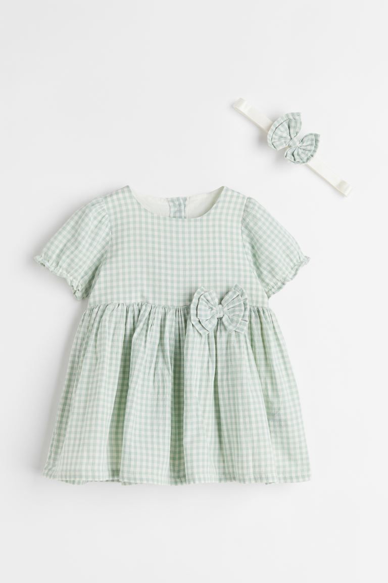 Dress in woven fabric with a matching hairband. Dress with buttons at back, short puff sleeves, a... | H&M (US + CA)