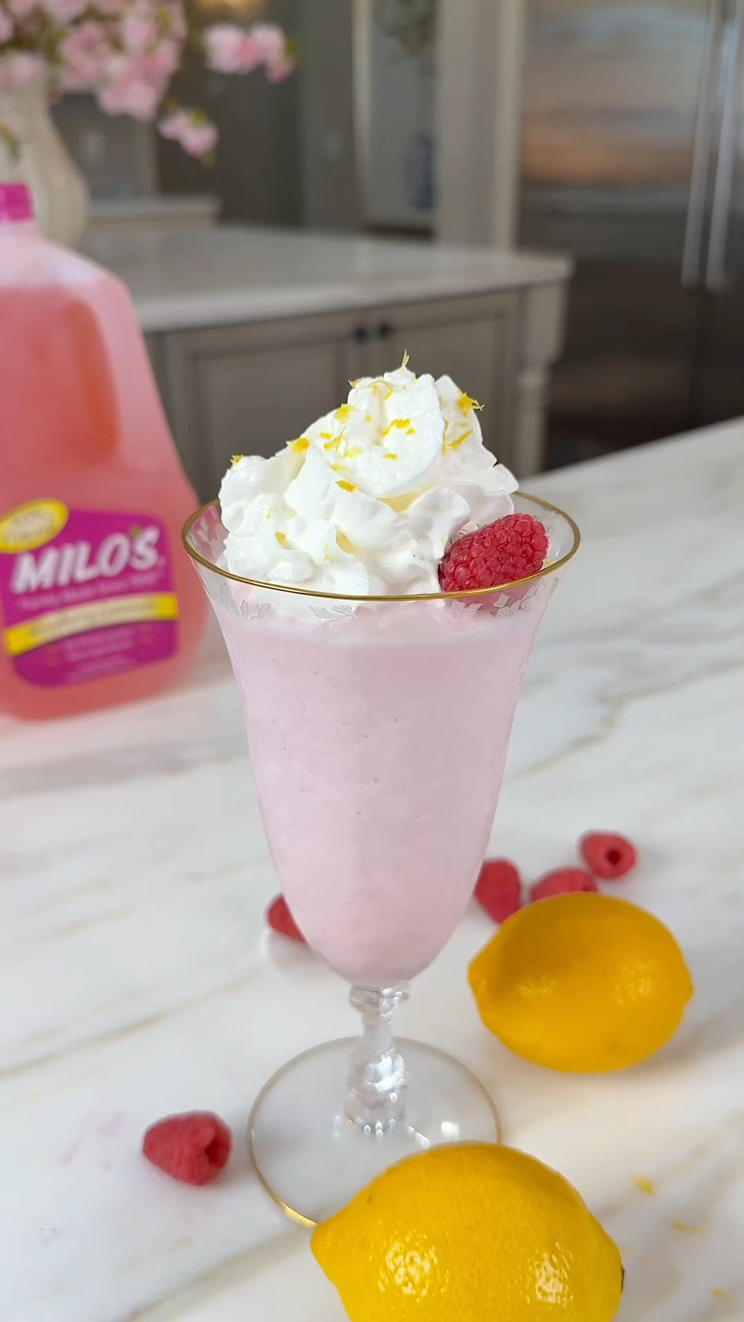 Nap time = mama’s snack time 💗 Today’s treat: a Frosted @drinkmilos Raspberry Lemonade and she is so good! Sweet, tart, creamy + the easiest little midday pick-me-up! 

Comment “SNACK” and I’ll DM you the full recipe.

Frosted Raspberry Lemonade:

-12 oz Milo’s Raspberry Lemonade, frozen
-1 scoop vanilla ice cream
- Splash (about 4 oz) Milo’s Raspberry Lemonade, not frozen
- Whipped cream (optional)
- Lemon zest (optional)

Blend all ingredients until smooth, top with whipped cream + a little lemon zest and enjoy! #MilosMomentMakers #raspberrylemonade #frostedlemonade #mocktailrecipe #pinkdrink

#LTKfoodie #LTKHome #LTKmomlife
