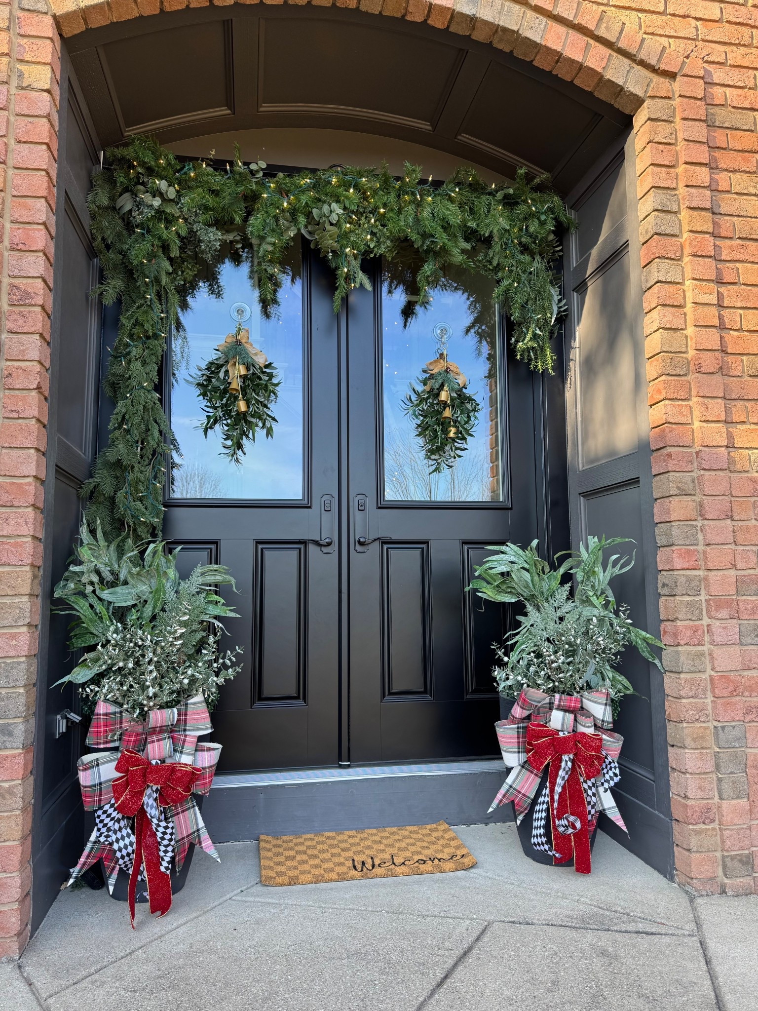 Christmas front porch decor. Christmas decorations. Holiday front porch. Garland. Christmas bow decor. 

#LTKHoliday #LTKCyberWeek #LTKHome
