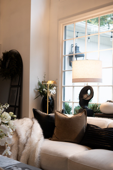 I’m absolutely loving my cozy Christmas living room! The soft glow from the lamp, festive greenery, and modern black-and-white décor make this space feel so magical. The big window lets in the perfect winter light, adding warmth and charm to every corner. It’s my dream modern holiday home, ready for Christmas gatherings and cozy nights in with the fam!! XxV 

 #LTKHoliday #LTKSeasonal #LTKHome