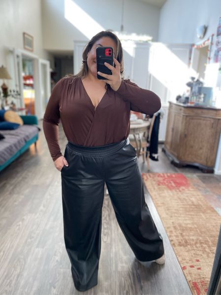 Thanksgiving Outfit.
Comfortable able polished vegan leather wide leg trousers with pockets. Pair with this Express v-neck body suite for holiday meals. 

#LTKstyletip #LTKmidsize #LTKsalealert