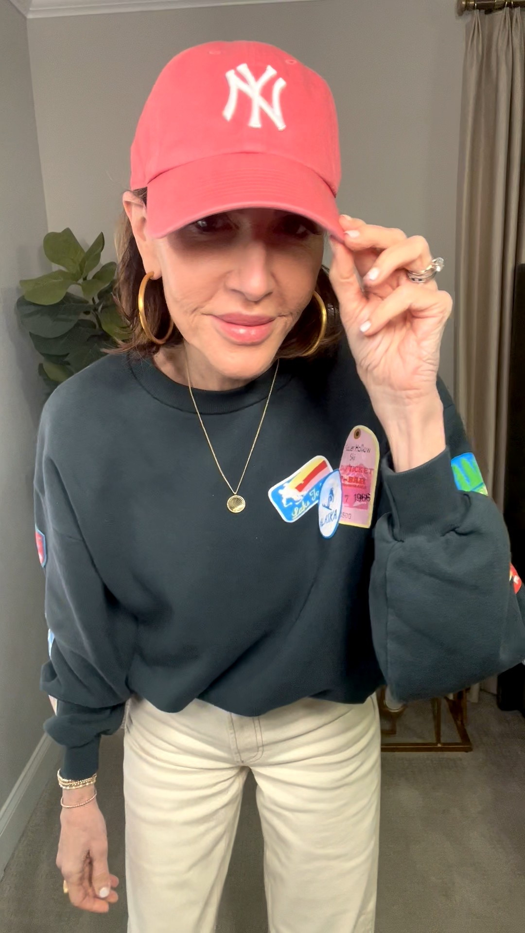 graphic pullover, ny hat, gold hoops, casual outfit 

#LTKootd #LTKSeasonal #LTKOver40