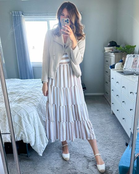 Tan and white striped tie shoulder dress with low heel closed toe white espadrille sandals. Paired with a tan Moto jacket that is 10% off with code Mackensey10

#LTKfindsunder100 #LTKsalealert #LTKSeasonal