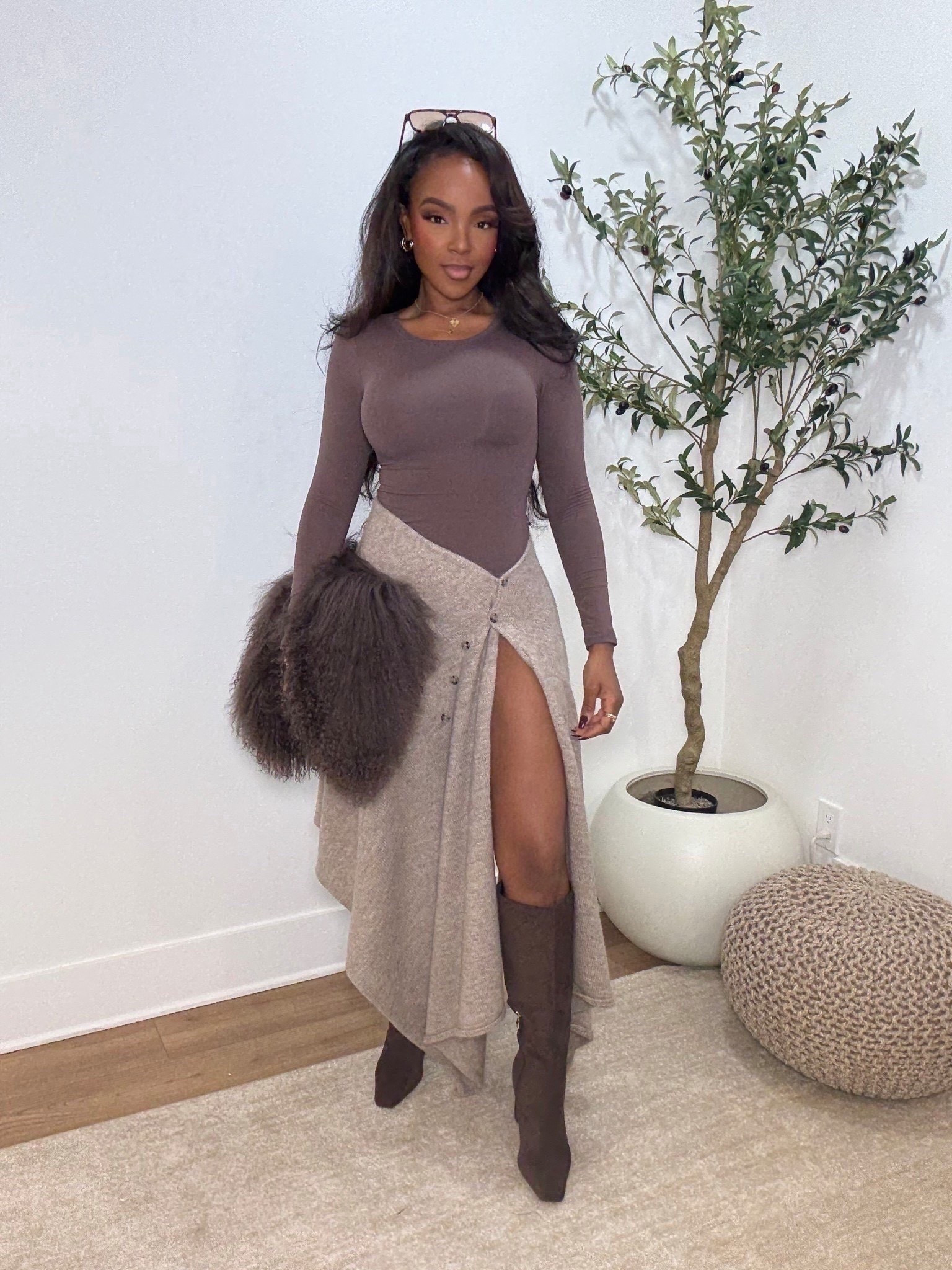 ✨ Neutral layers with elevated texture — a chic, timeless look that feels effortlessly put together. The fitted long-sleeve top paired with a draped midi skirt creates the most flattering silhouette, and the high slit adds just the right amount of edge. Finished with knee-high boots for a polished, seasonless outfit you’ll reach for again and again.

Perfect for dinner dates, brunch plans, fall events, or elevated everyday wear.

📏 Sizing:
Top: Size Small  
Skirt: Size Small  
Boots: True to size  

This is one of those outfits that works styled multiple ways — swap boots for heels or flats and the cost per wear keeps dropping, making it a smart long-term shopping strategy.

Favorite to revisit later and shop all the details directly in the app.

Follow me on Instagram and YouTube @kirasfashionfinds