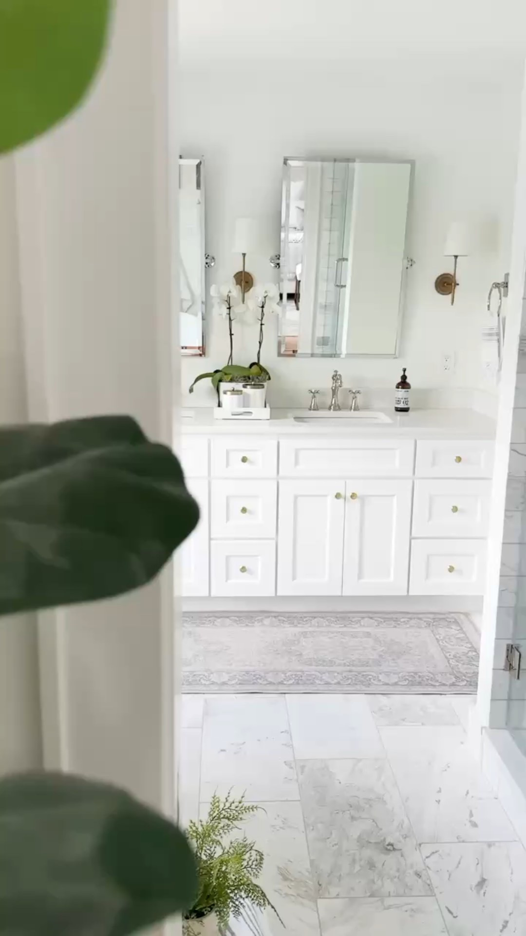 This primary bath is all about elevated ease—marble finishes, a deep soaking tub, warm brass accents, and a washable runner that softens the space without the stress. I mixed metals throughout to keep it feeling collected, not too matchy. Linked the exact sconces, rug, and a few timeless bathroom details you can layer into your own home. #LTKhome #bathroomdesign #primarybathroom #modernclassic #marblebathroom #brassfixtures #spaathome

#LTKHome #LTKStyleTip #LTKFindsUnder100