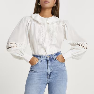 Cream lace cut out detail blouse | River Island (UK & IE)
