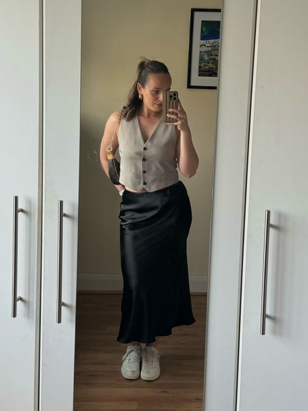 Spring outfit styling a satin skirt with a waistcoat #springoutfit #ltkspring 

#LTKuk #LTKeurope #LTKspring