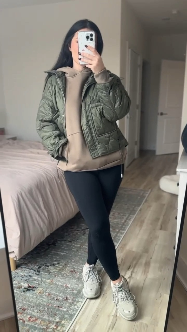 Casual ootd with brown hoodie sweatshirt, olive green quilted jacket, and black high waisted leggings with tan sneakers

#LTKSeasonal #LTKfindsunder50 #LTKstyletip