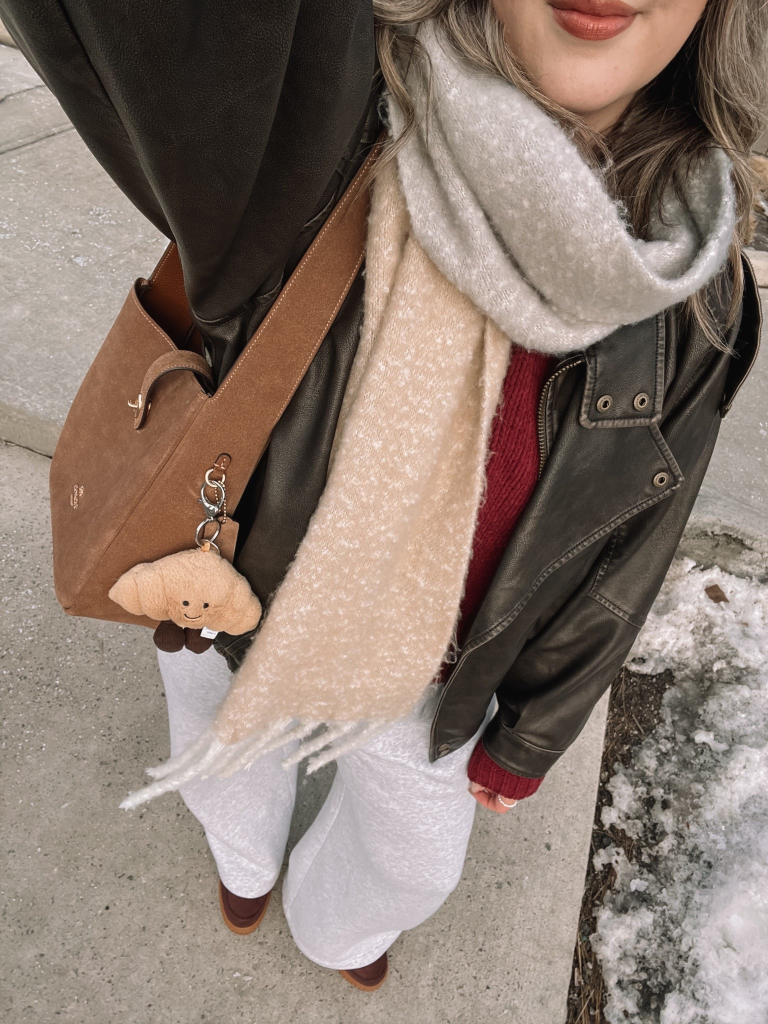 Comfy casual winter outfit! Wearing my usual size L in the wide leg sweatpants, burgundy chenille sweater, white tee, and oversized leather jacket. Sorel snow boots are waterproof and so cozy, consider sizing up if you plan to wear thick socks. Linked similar scarves


#LTKmidsize #LTKwinter #LTKsale