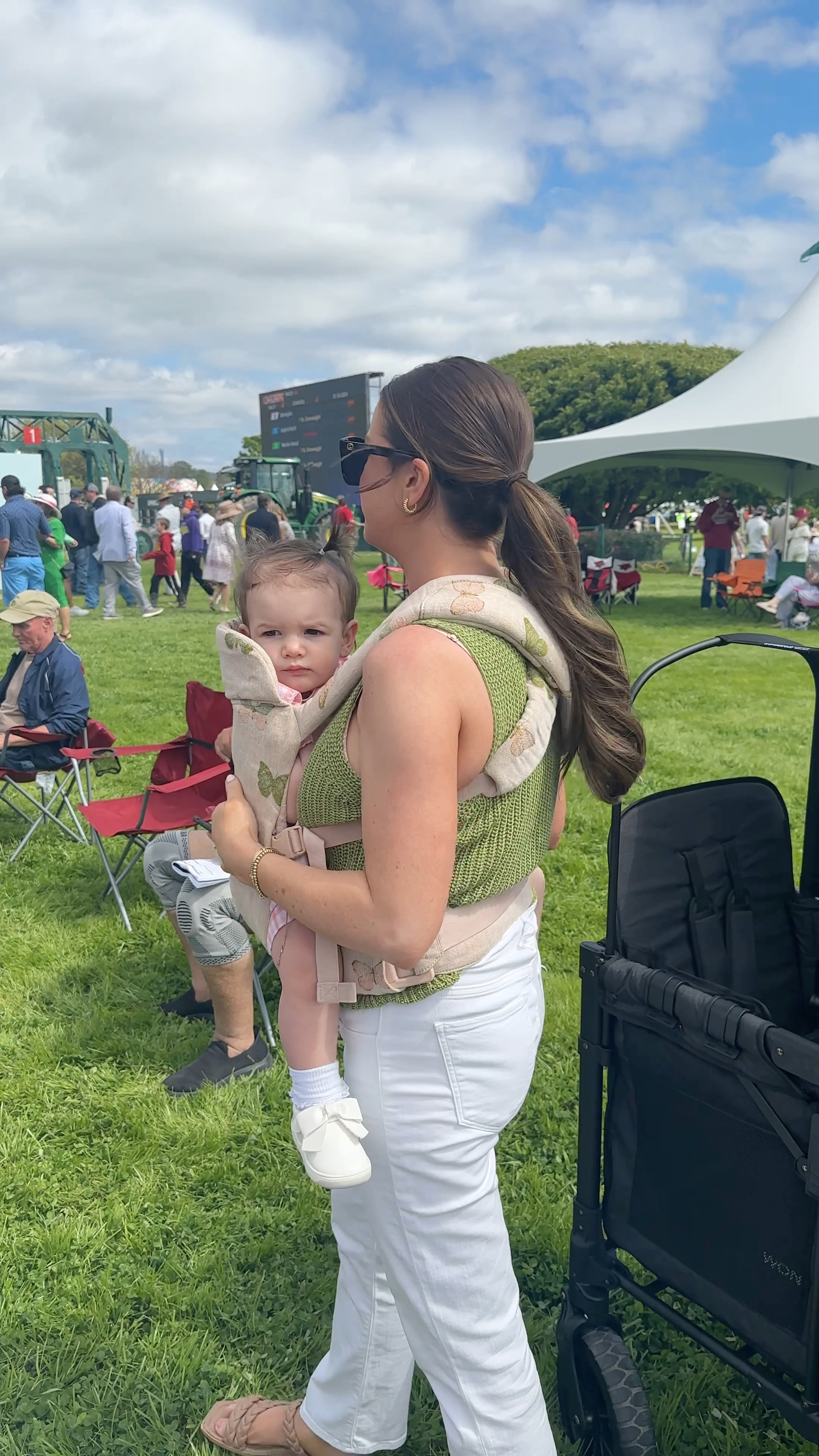 Baby wearing and spring summer outfits! White jeans, sweater tank, toddler shoes, bows