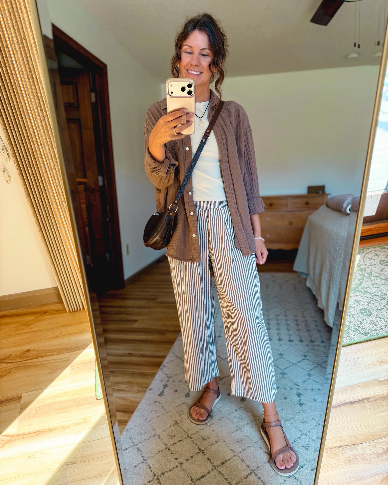 small in my tee shirt, xs in my gauze cotton button up, small in my striped pants and 6 in my sandals.

My necklace is thrifted so I linked similar.