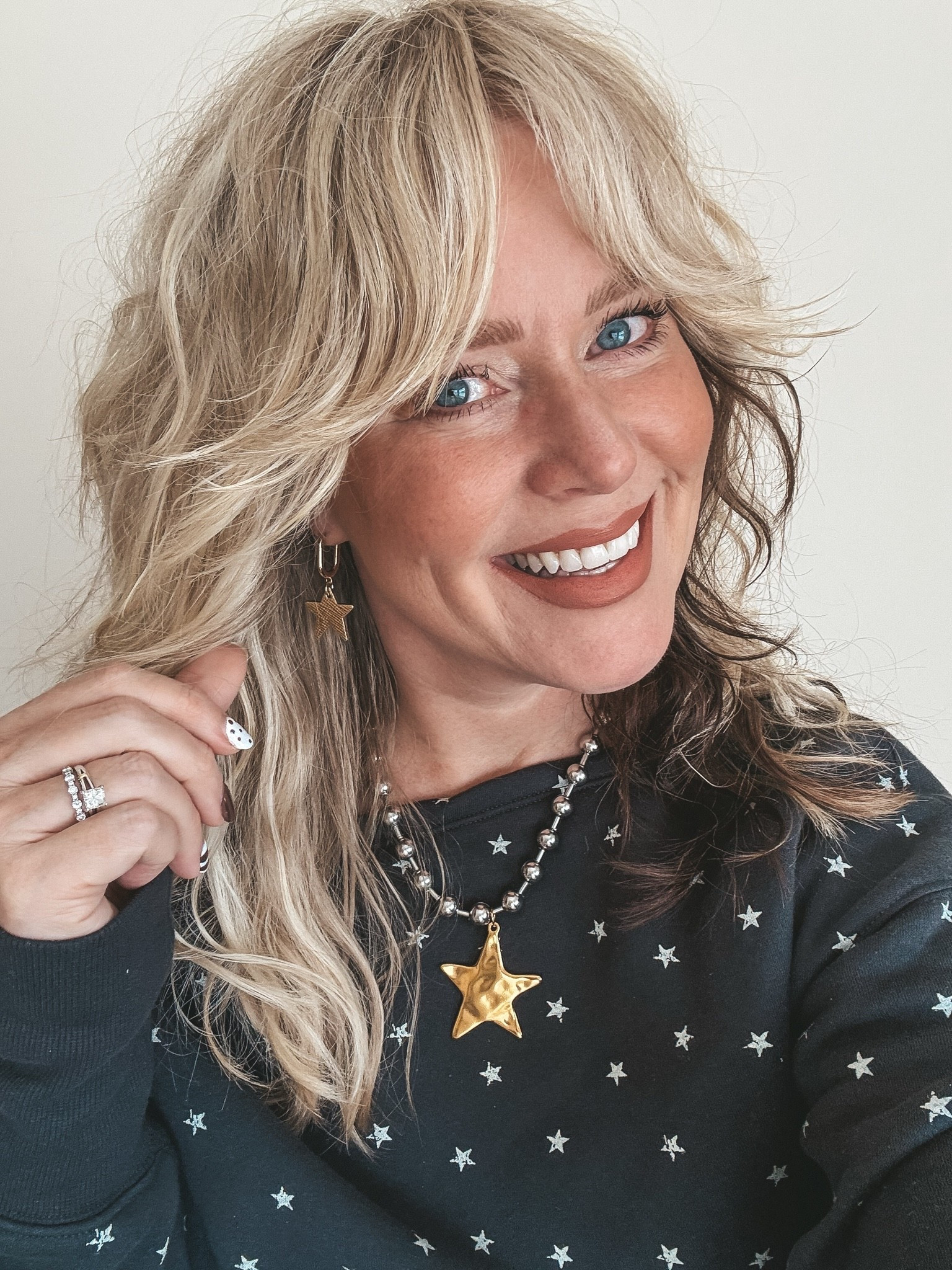 Save on my star necklace with code MANDIE 
This star print off shoulder sweatshirt is so fun and I’m in a medium.