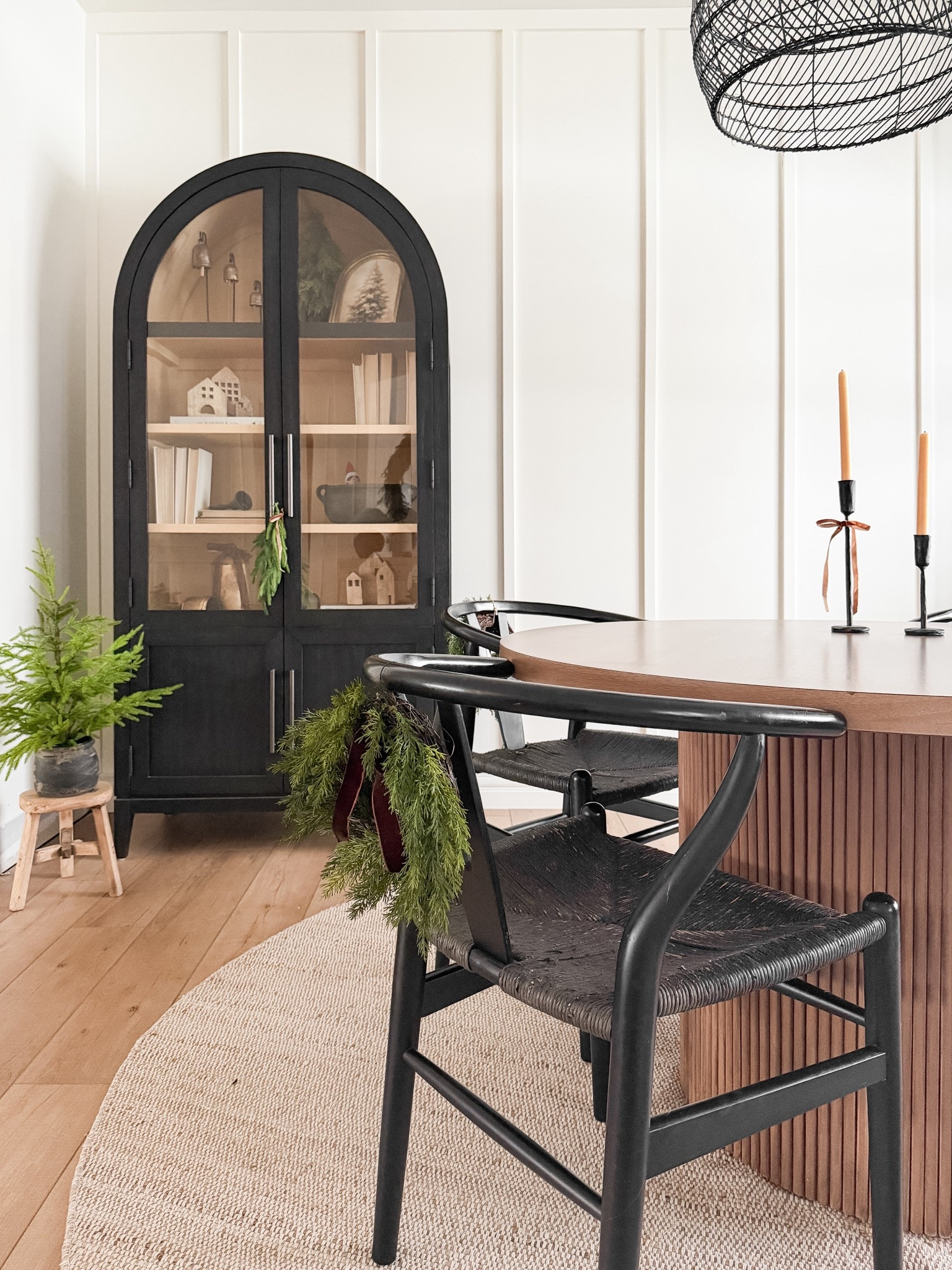 The dining room always feels a little more magical this time of year 🥰
The round table keeps the space feeling warm and connected, the arched cabinet adds character, and I love how the little wood village and mini wreaths bring in a subtle holiday touch without taking over the room.

It’s simple, cozy, and layered with pieces we already love just enough festive detail to make everyday meals feel special. This is the kind of holiday styling that feels calm, intentional, and easy to live with.

#LTKholiday #LTKsale #LTKhome
