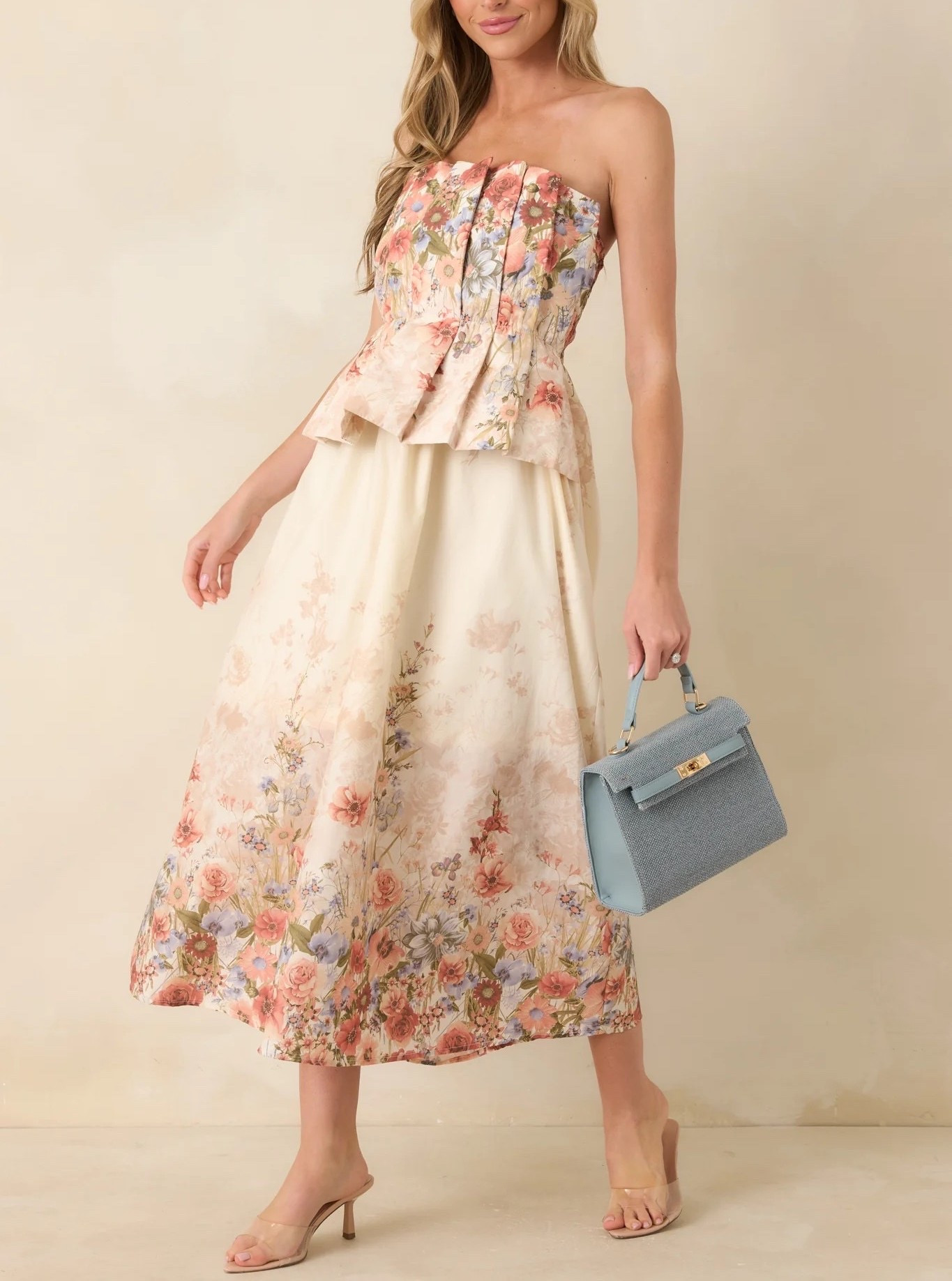 Lightweight, romantic, and beautifully flattering, this cotton midi dress creates an effortlessly polished look for daytime and evening events alike. Under $100. Style the look with a chic blue bag.

Keywords:

* floral midi dress
* strapless midi dress
* cotton midi dress
* pink floral dress
* romantic summer dress
* feminine midi dress
* vacation dress
* summer event dress
* garden party outfit
* brunch dress
* vacation outfit
* baby shower dress
* wedding guest dress
* european summer style
* daytime event outfit
* resort wear

#LTKMothersDay #LTKTravel #LTKWedding