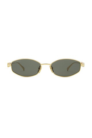 Gucci Oval Sunglasses in Gold & Grey from Revolve.com | Revolve Clothing (Global)