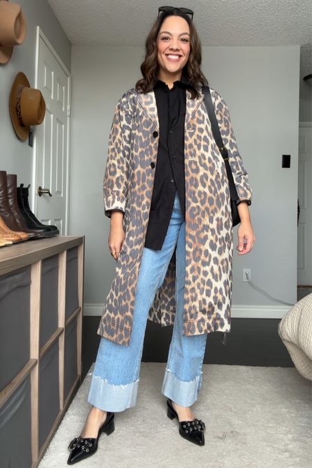 Styling a leopard print trench coat! Details below:
-Ganni leopard print trench coat. I have a size 40. 
-Abercrombie light wash cuffed jeans, I have a size 29. 
-Black poplin button up, similar linked. 
-Madewell black leather bucket tote bag. 
-Celine Triomphe sunglasses. 

#LTKSeasonal #LTKMostLoved #LTKstyletip