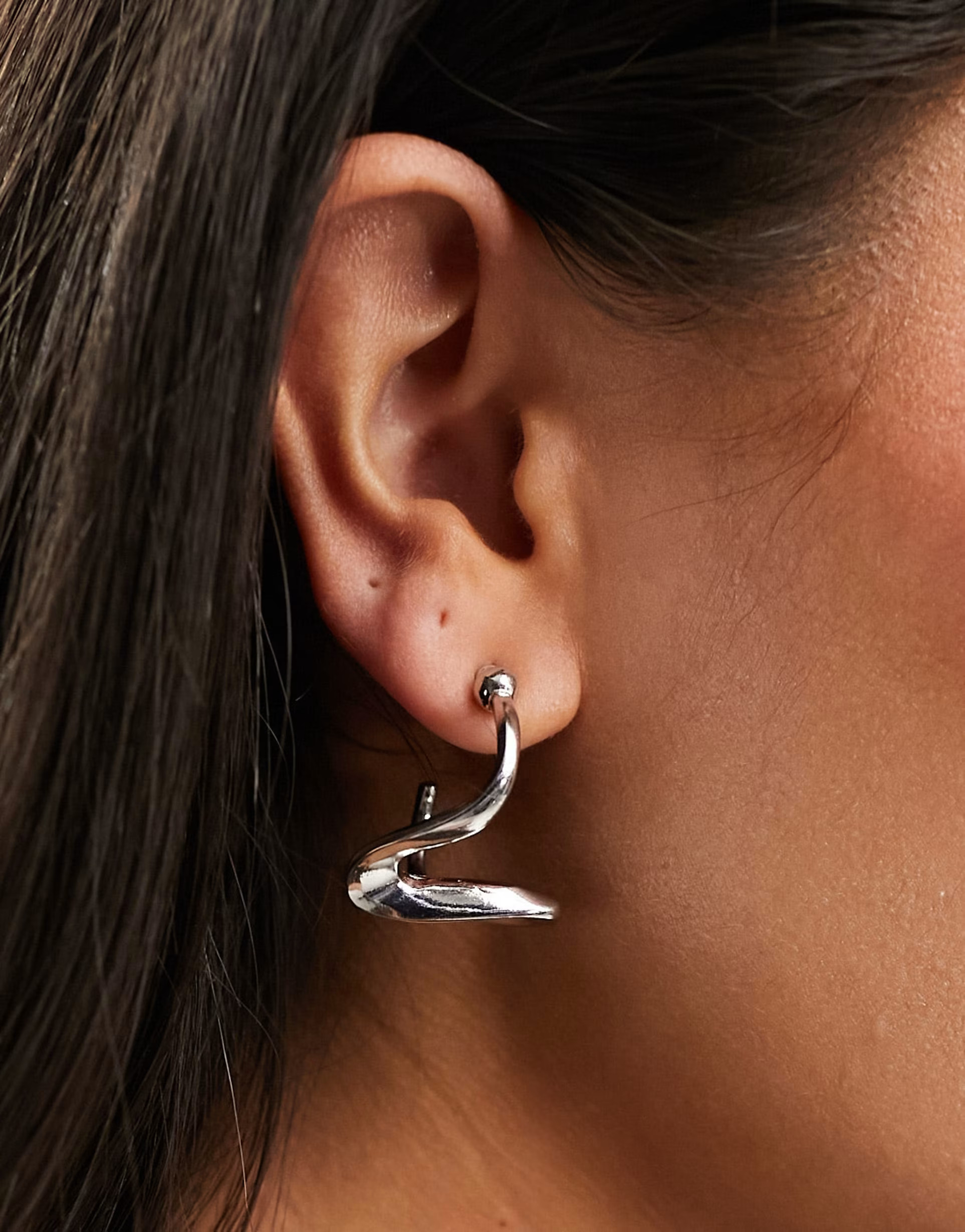 ASOS DESIGN hoop earrings with abstract wave design in silver tone | ASOS (Global)