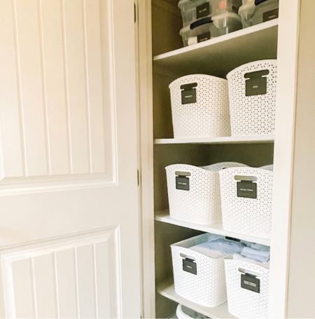 Organize a linen closet easily with bins and labels