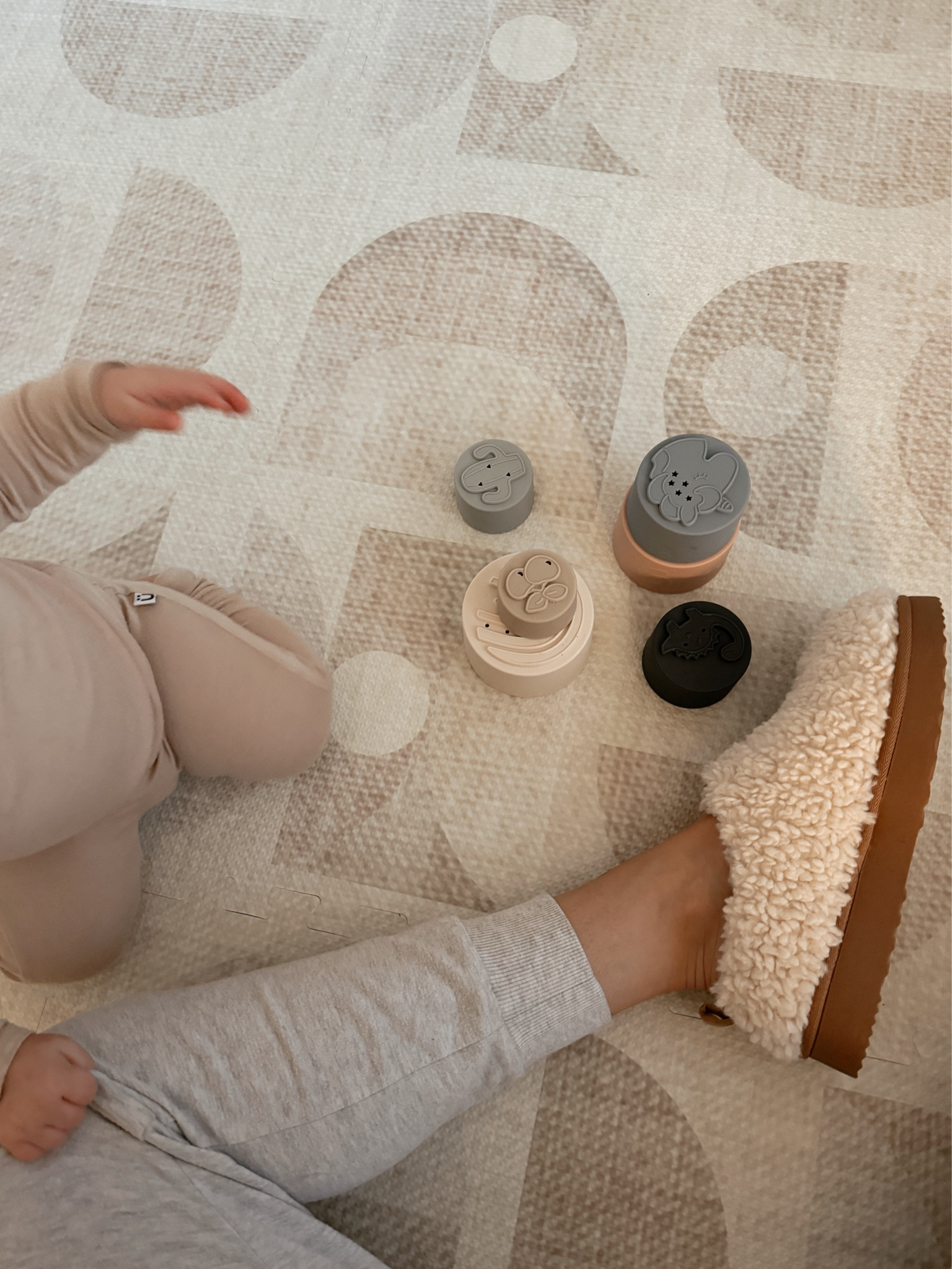 cozy little target slippers & morning play time. love these silicone stacking cups.