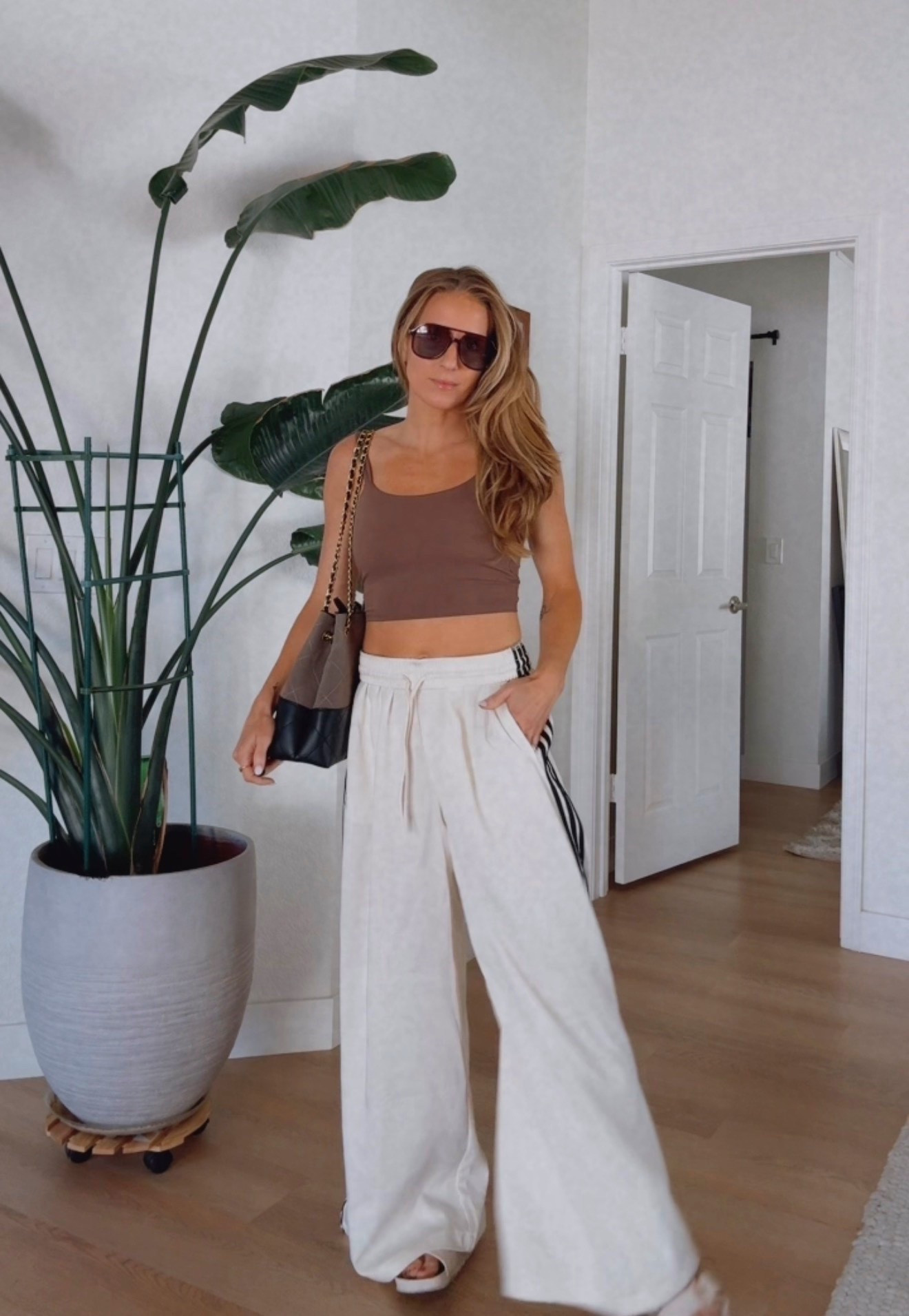 Obsessed with this built in bra top from Amazon and these extra wide leg pants from Adidas! I’m wearing a size 6 in the pants and they are very long and tall girl friendly. I hemmed them to fit me better but still have length!

#LTKgrwm #LTKootd #LTKActive