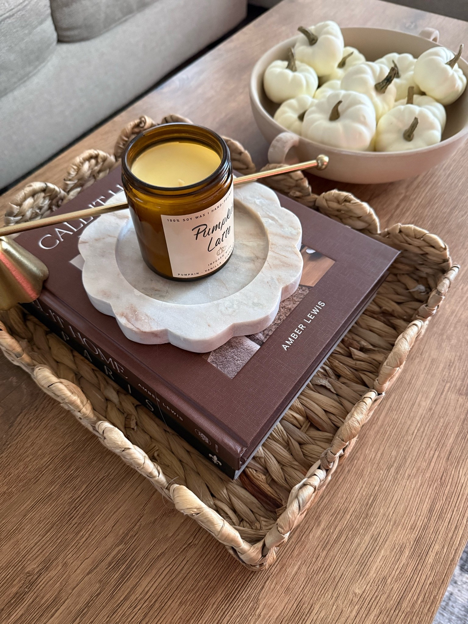 Cute and simple fall decor for the coffee table might include a fall-scented candle and a stack of books, which add warmth to the space.

#LTKSeasonal #LTKHome #LTKSaleAlert