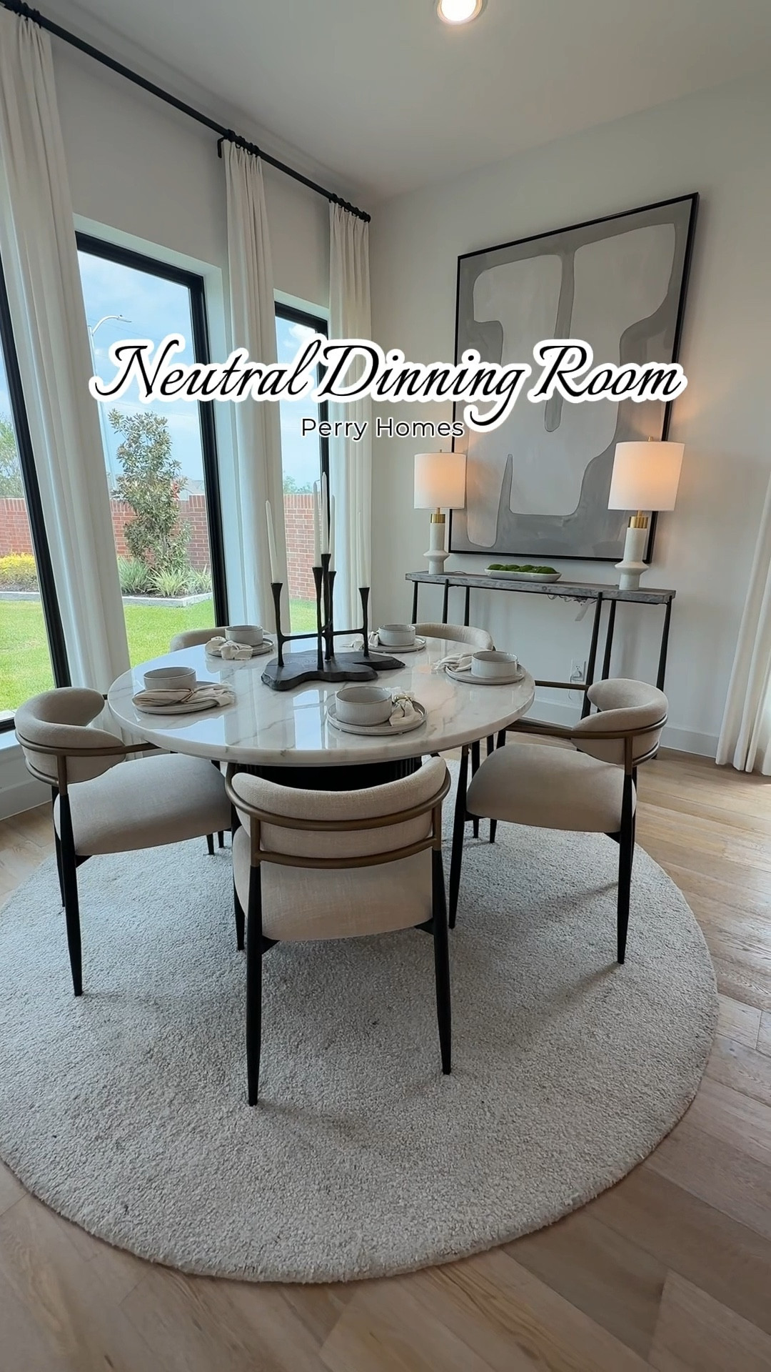 Minimalist luxury meets everyday comfort in this modern neutral dining room. Shop the look: neutral dining chairs, round marble table, modern console, oversized abstract art, black table lamps, and cozy textured rug.


#LTKHome