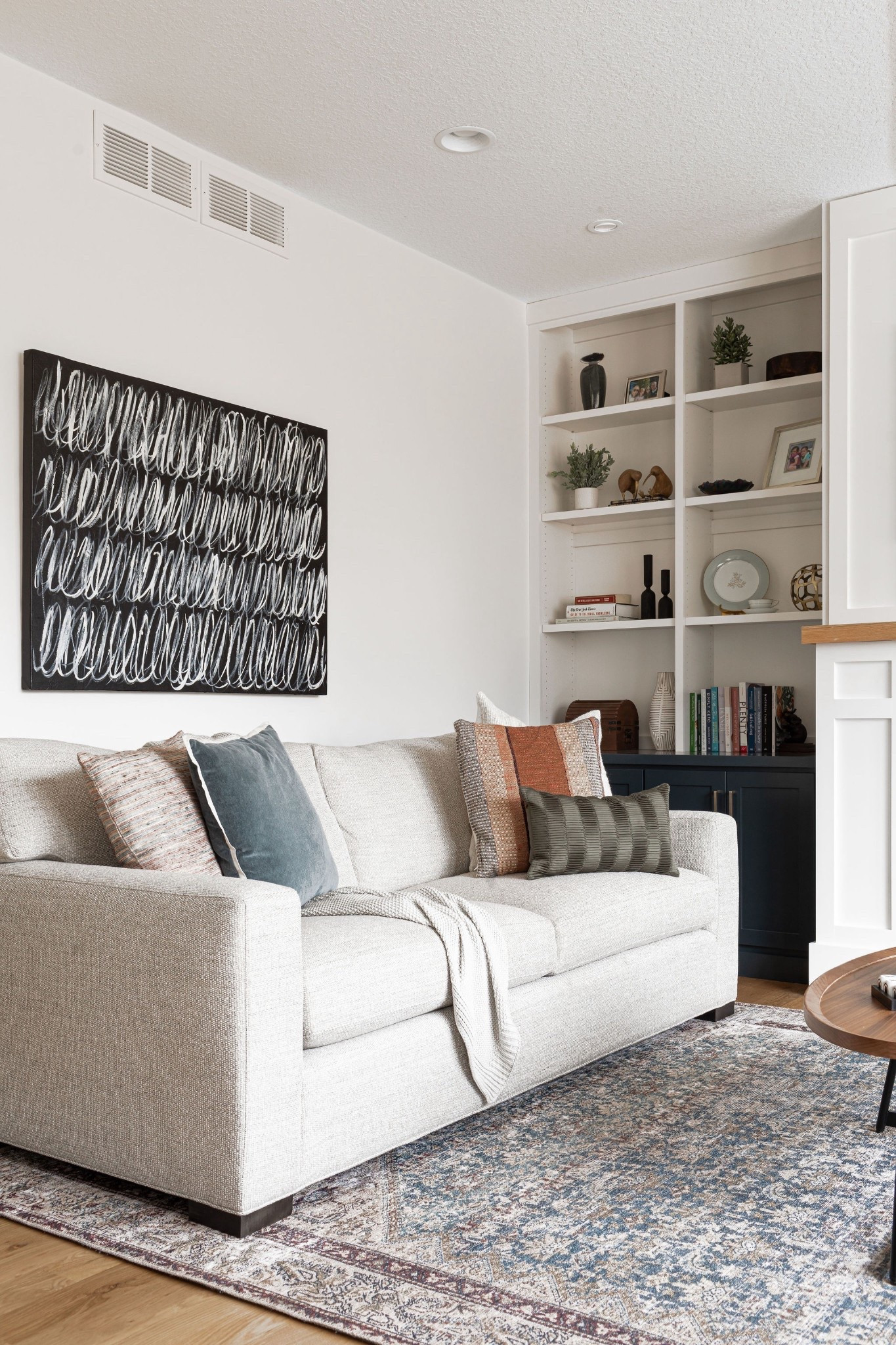 Couch styling tip.➡️ We love draping a blanket over the sofa, then adding 2-3 mismatched pillows on either end. That classic velvet pillow cover, shown in ocean, is a favorite and is available in several different hues. Living room scenes from our #IGHnewbuild project.

#LTKStyleTip #LTKFindsUnder100 #LTKHome