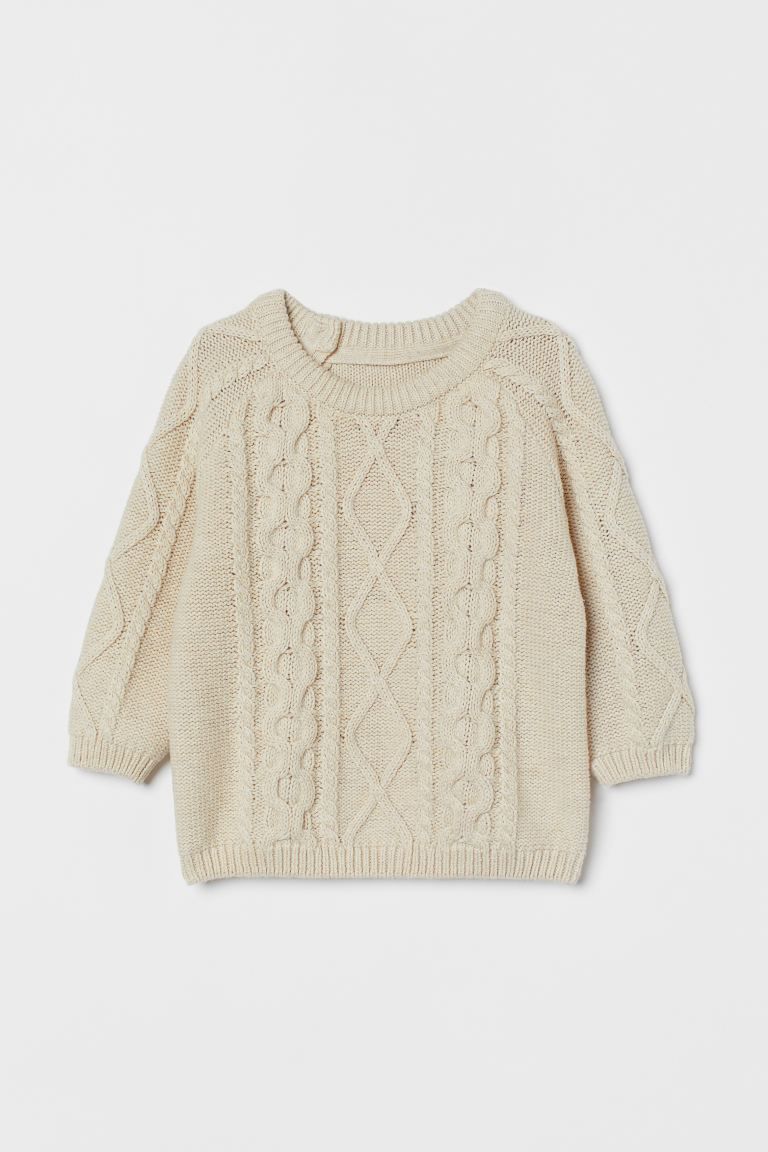 Cable-knit sweater in a cotton blend with wool content. Long sleeves, buttons at back of one shou... | H&M (US + CA)