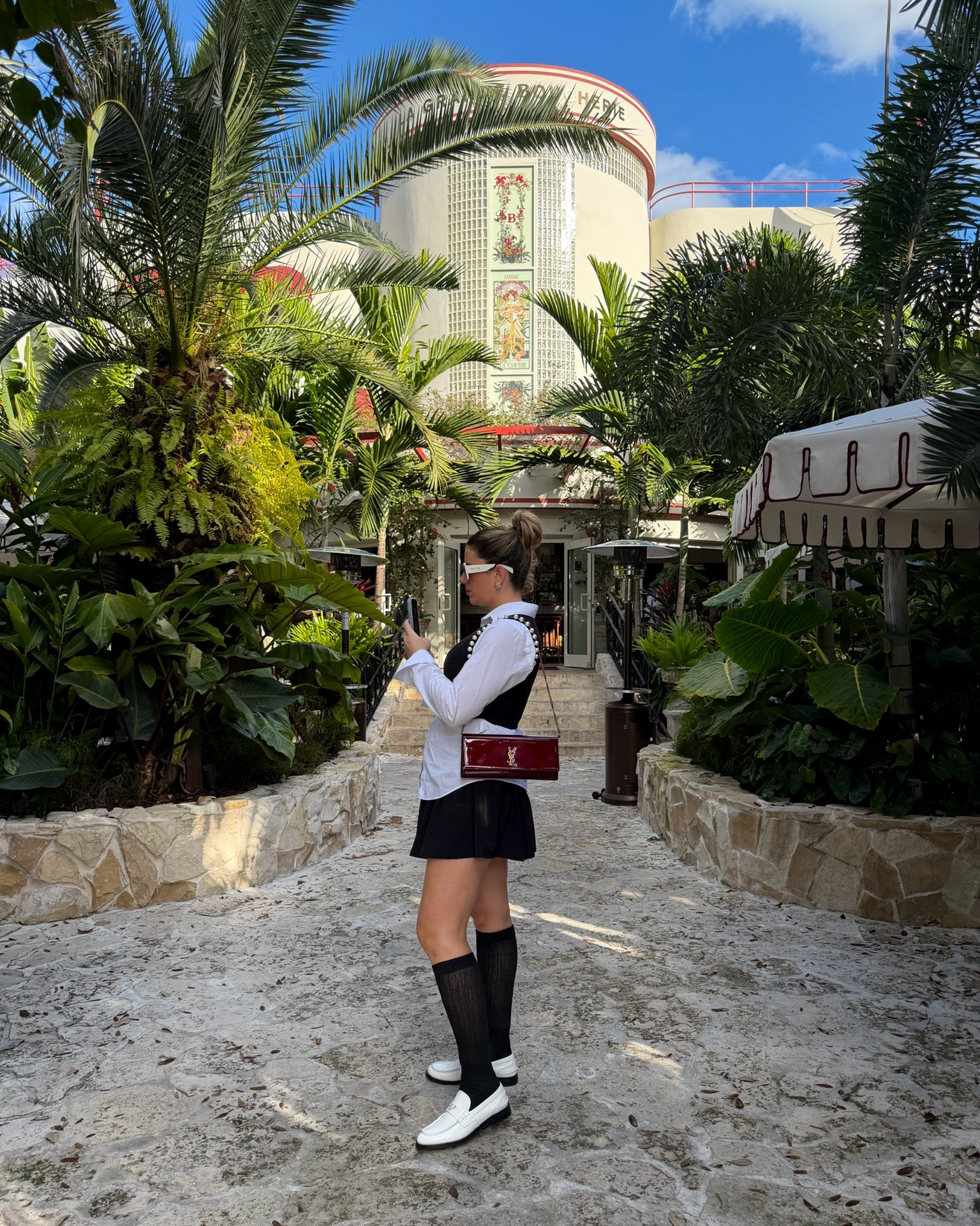 Probably my favorite outfit I’ve styled this year! 🤌🏼✨🖤🤍♥️ it’s giving Coco Chanel & Prada but with Prada & YSL or is it giving Cher from Clueless? I’m not sure but I LOVE this chic, timeless, elegant and effortless look. 

This look was all about styling my brand new white Prada loafers 👞 piece it together with an oversized white button up, black, knee-high, socks, black chic pearl vest, my Saint Laurent YSL handbag purse, white sunglasses, black skirt. 

This is a fun Sunday brunch look perfect for fall, winter & spring. Very European and Parisian. Outfit. Chic causal day to day. Business casual. A little little pieces to elevate my look. Fashion capital vibes — Miami girl. Luxury designer 

#prada #ysl #loafers #chanel #chic #elegant #timeless #kneehigh #skirt #ootd #luxury #sundaybrunch #brunch #clueless #paris #fashionweek #italy #milan #miami 

#LTKSeasonal #LTKdayinmylife #LTKootd